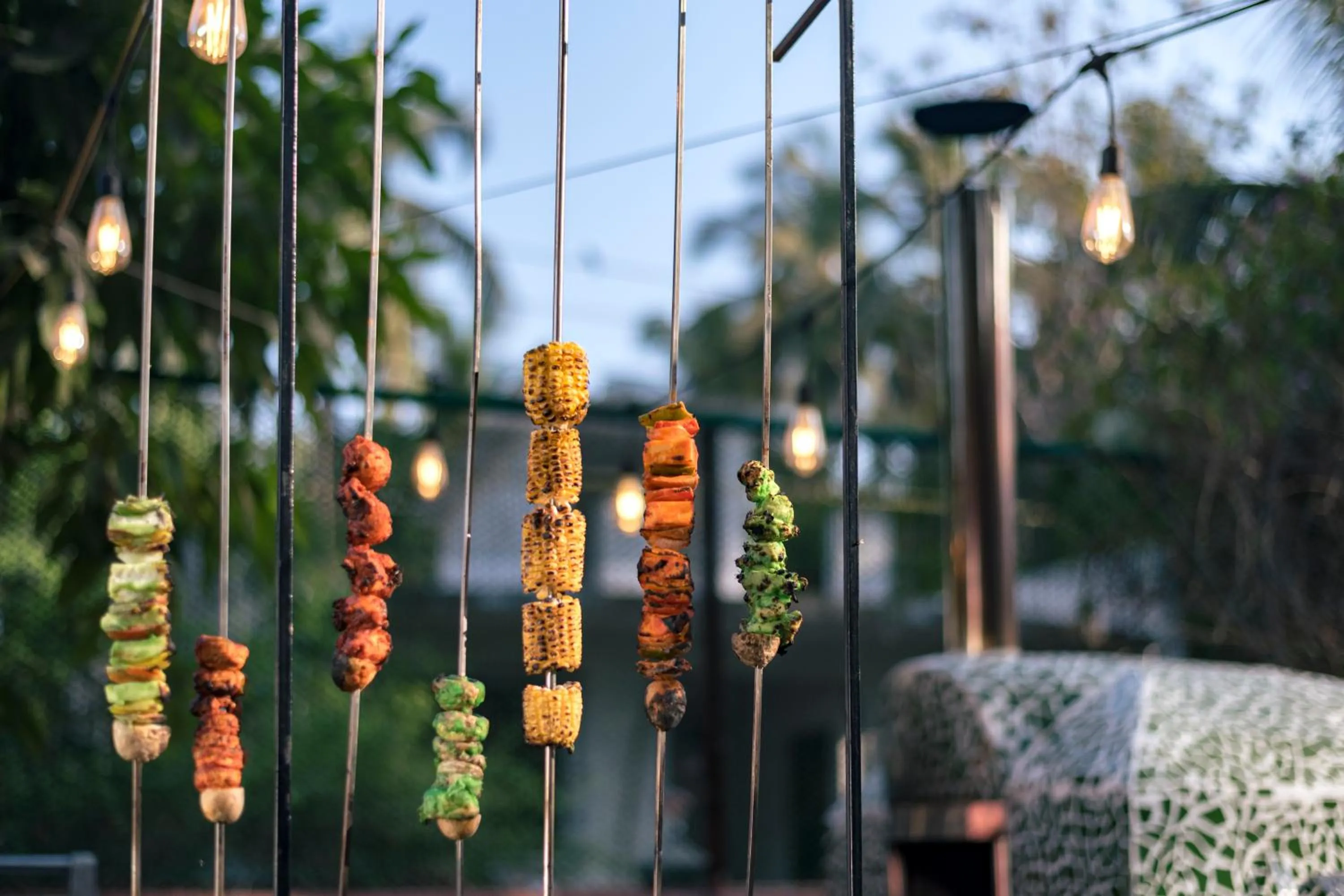 Food close-up in SaffronStays Casa Del Palms - 8BR luxury pool villa with gazebo, pickleball, bar & lawns near Nagaon Beach