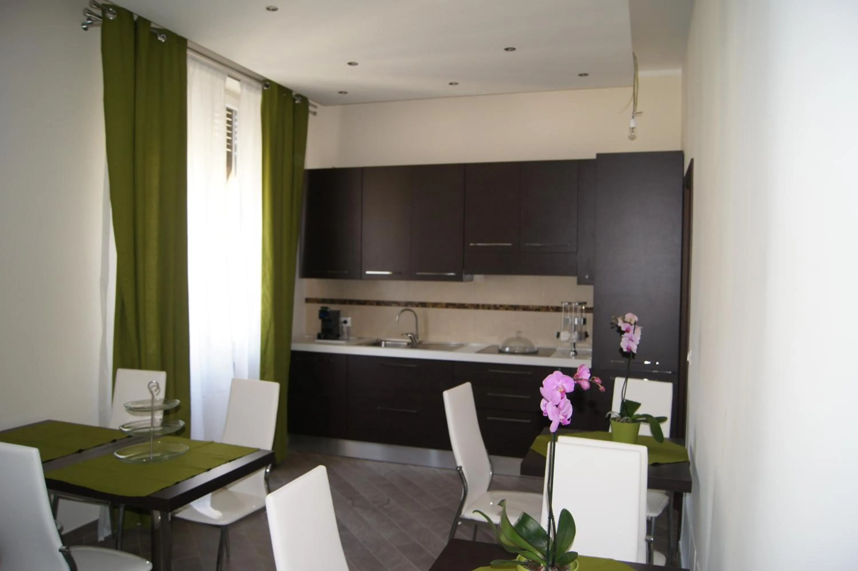 Communal lounge/ TV room in Mia Suites