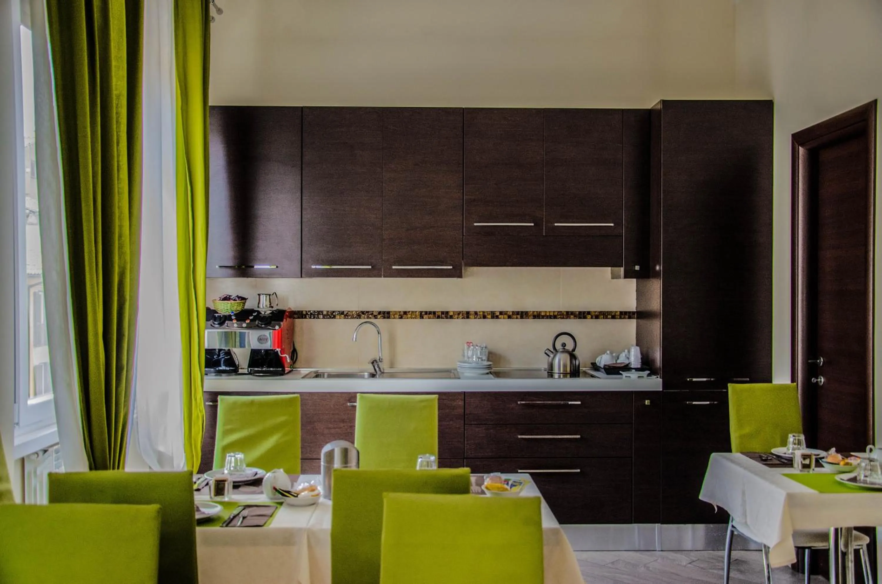 Communal lounge/ TV room in Mia Suites