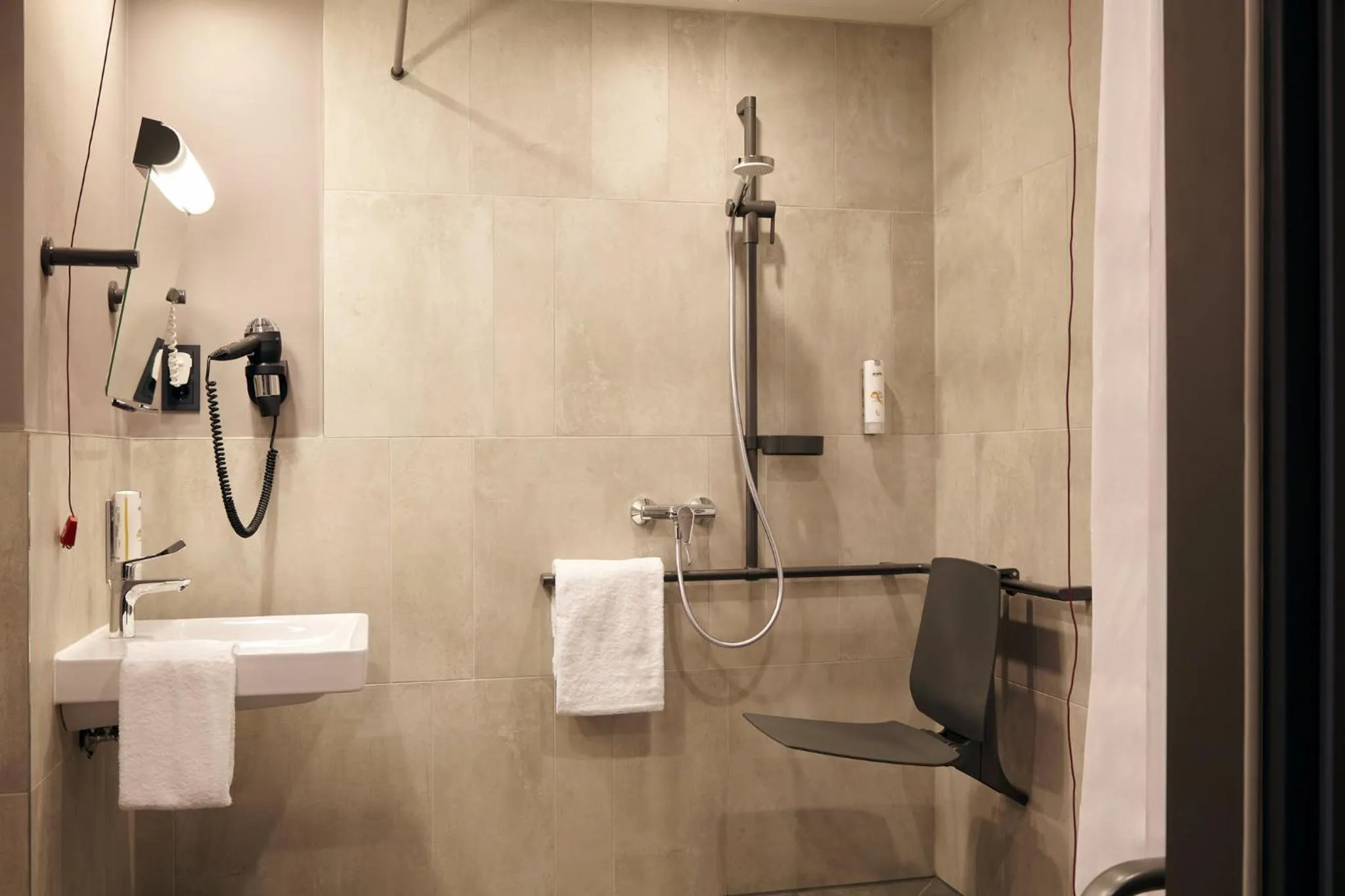 Bathroom in Candlewood Suites Düsseldorf Airport by IHG