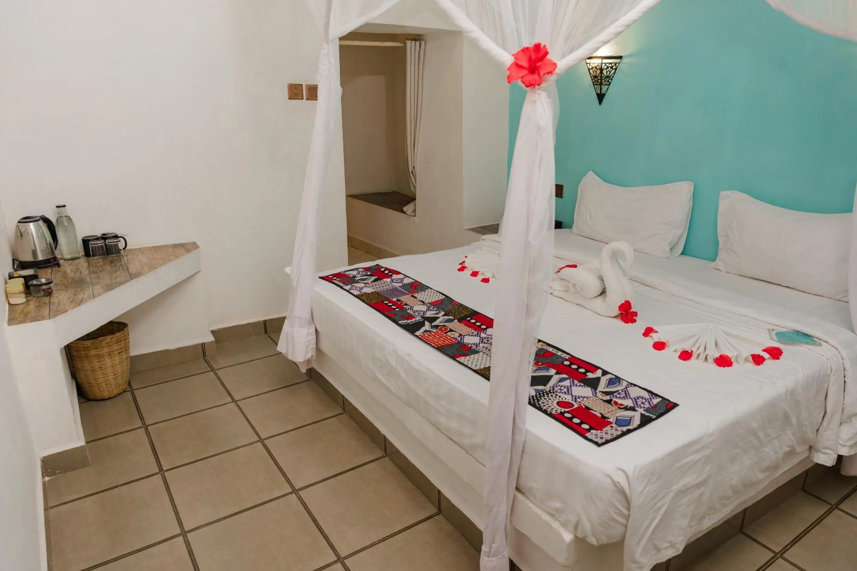 Bed in Emerald Palm Courtyard Hotel