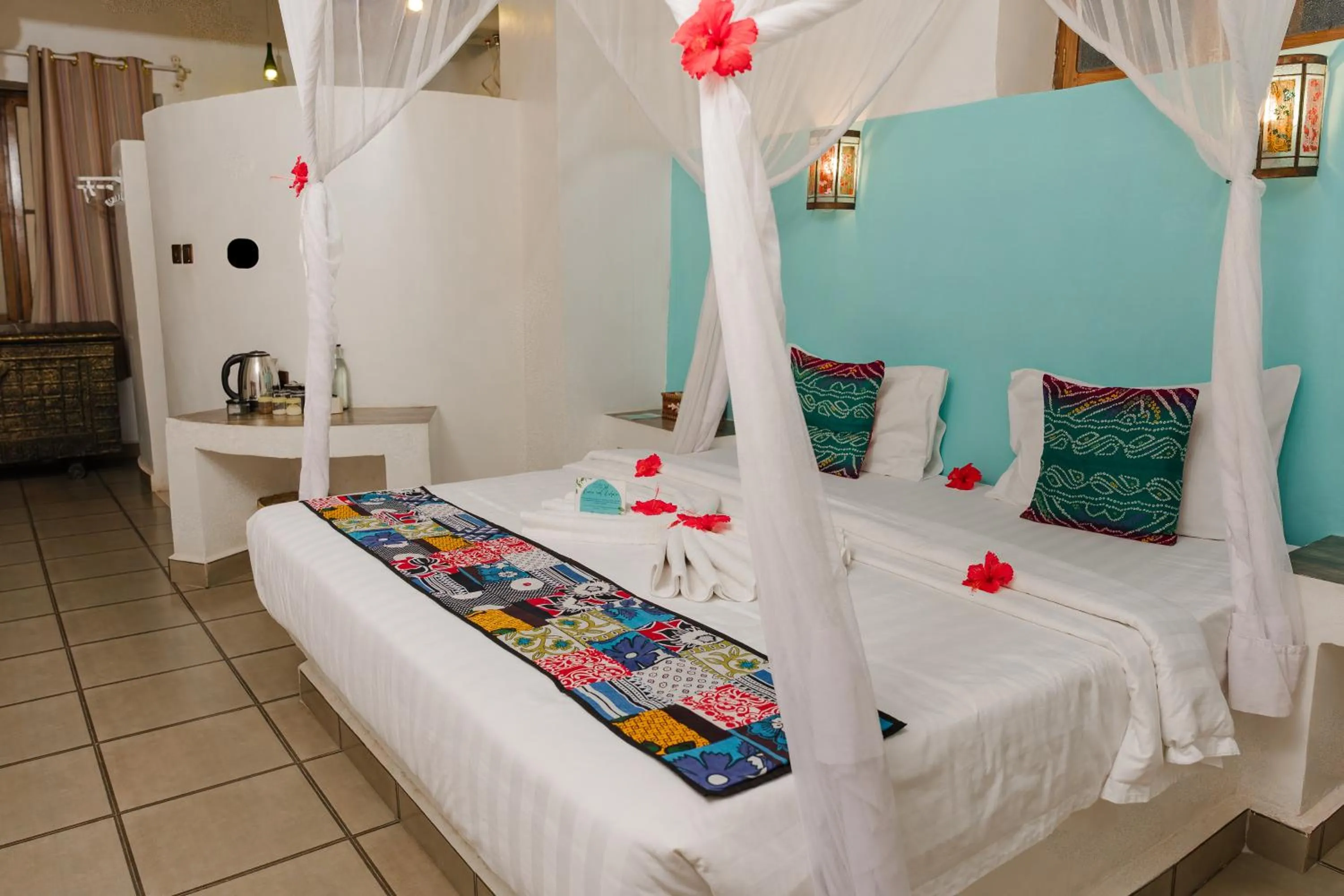 Bed in Emerald Palm Courtyard Hotel