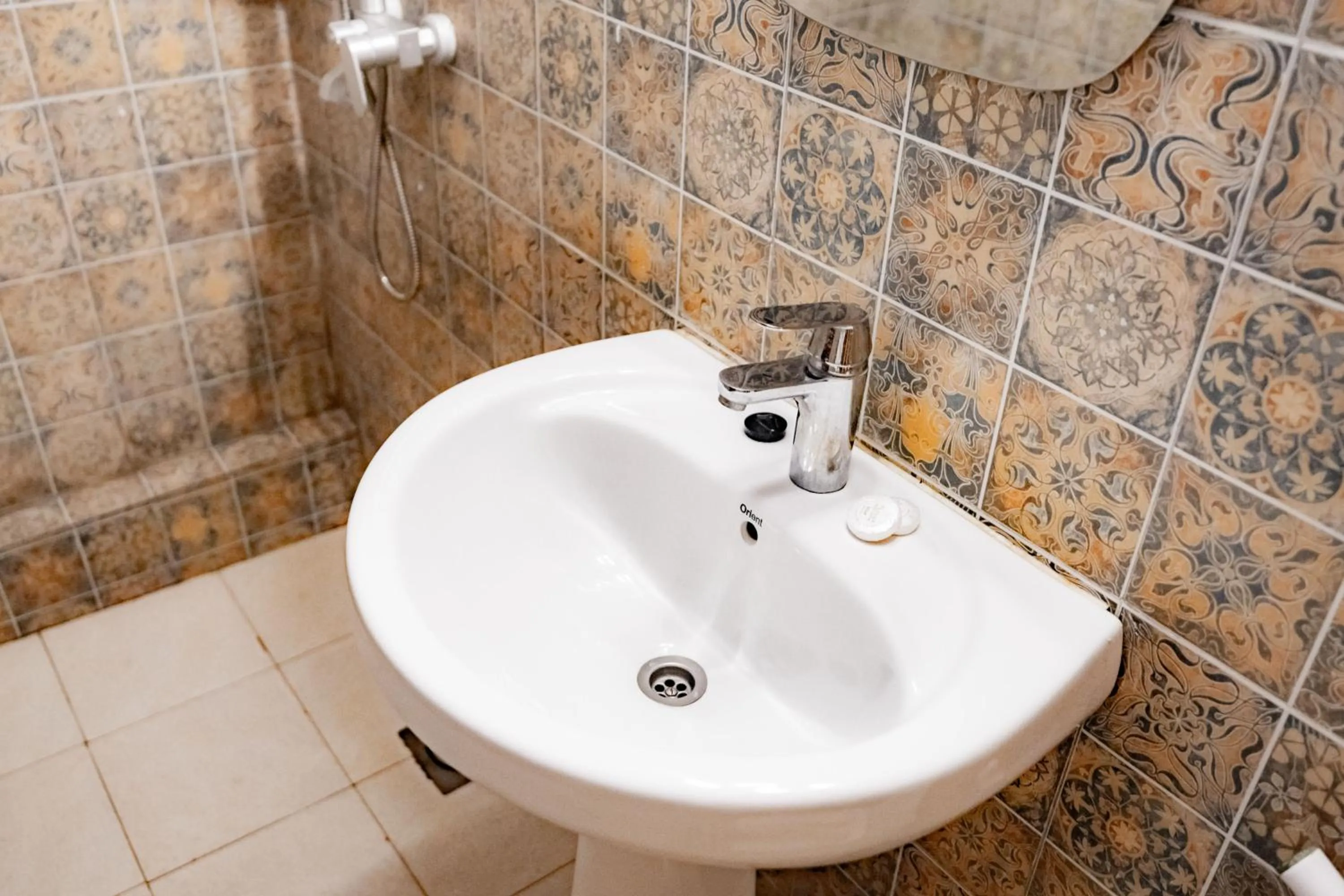 Toilet in Emerald Palm Courtyard Hotel