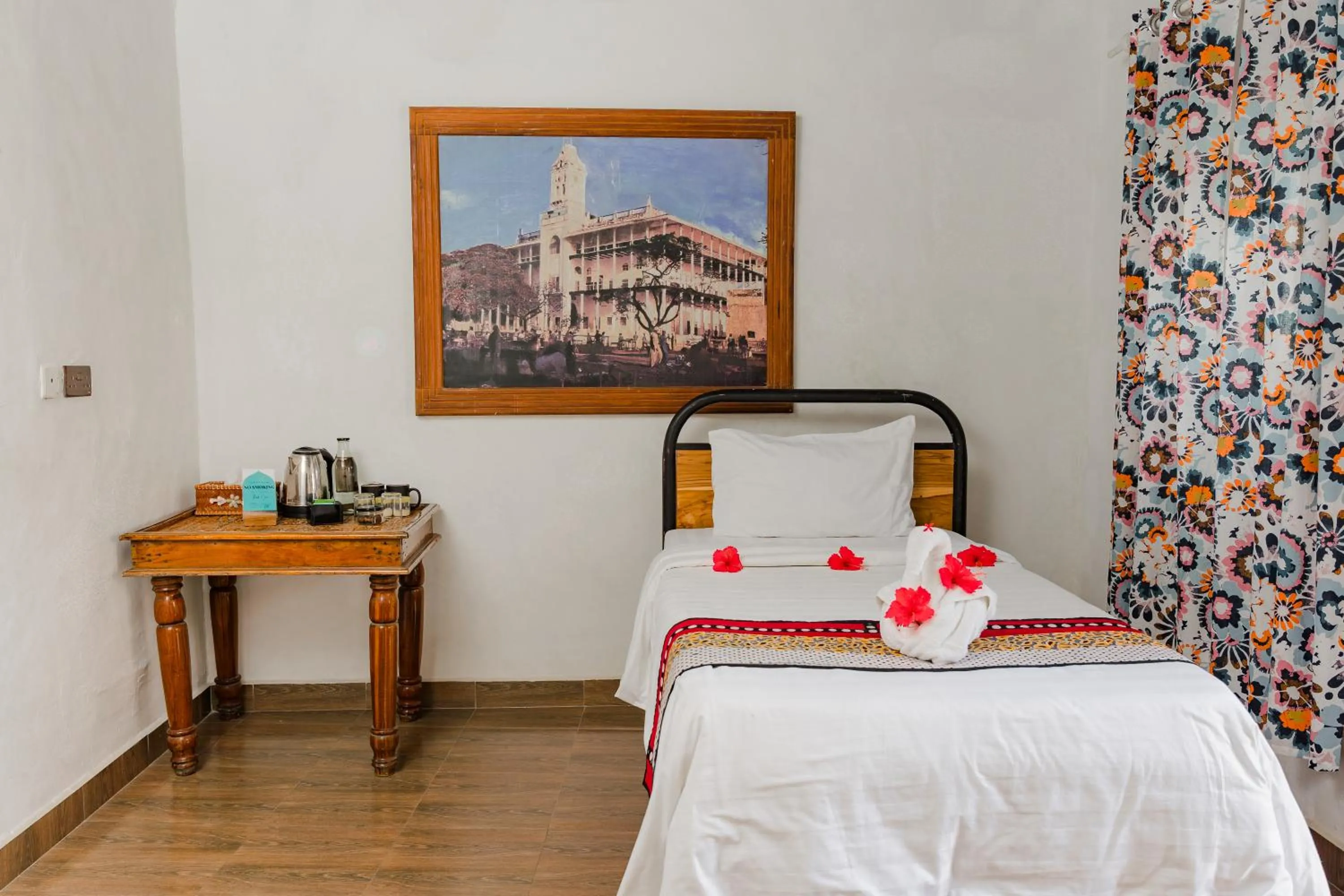 Bed in Emerald Palm Courtyard Hotel