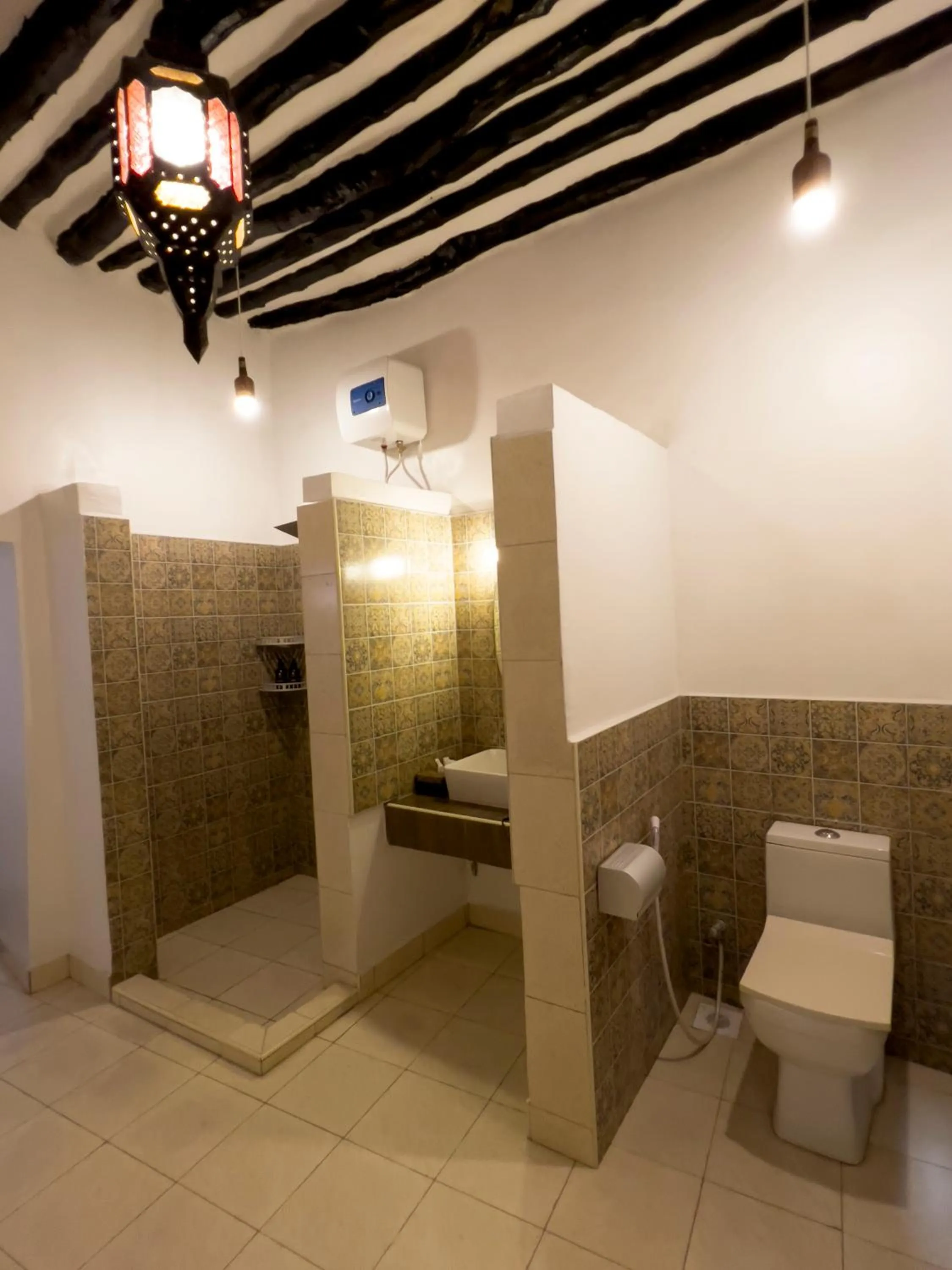 Toilet in Emerald Palm Courtyard Hotel