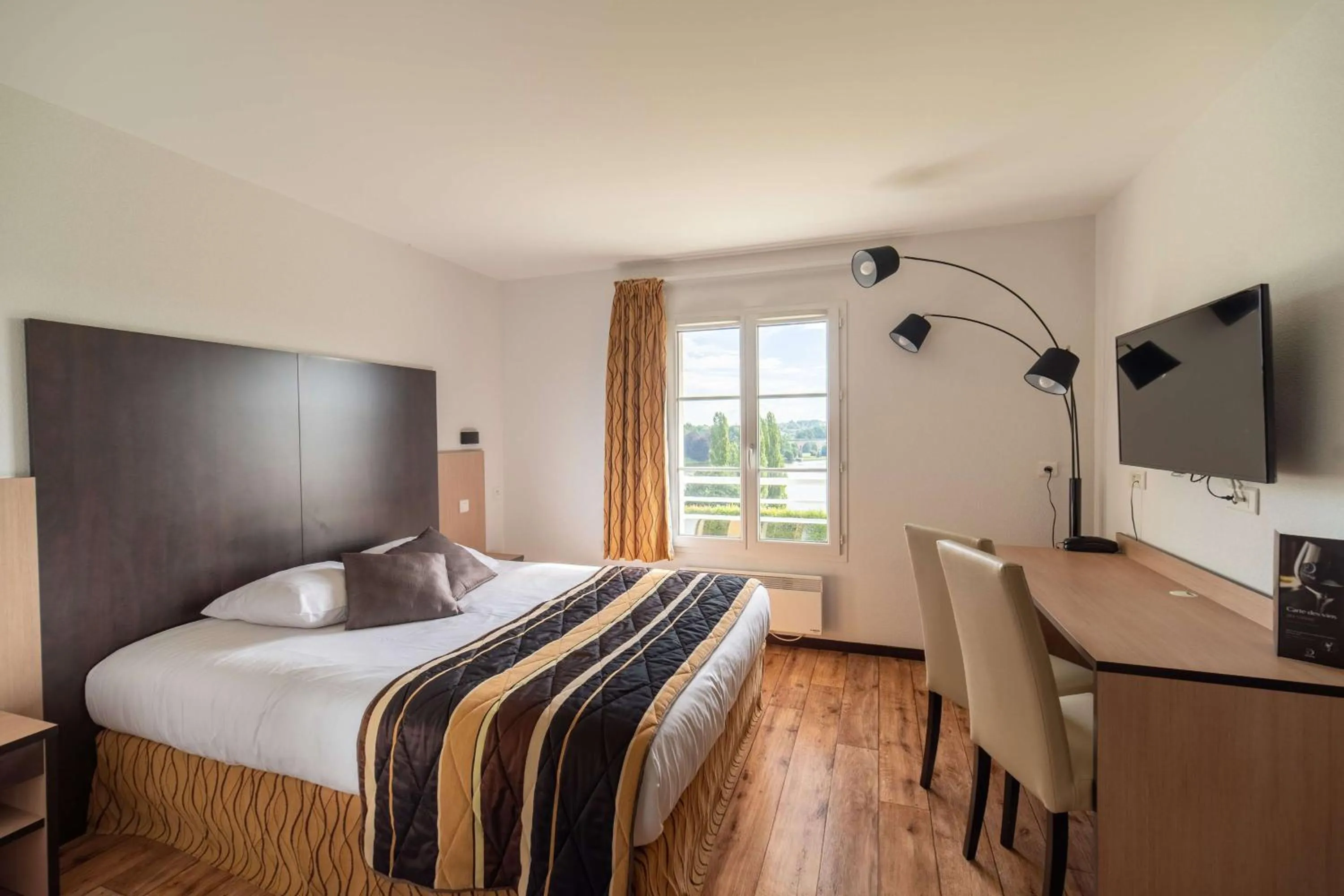 Bedroom, Bed in Brit Hotel Confort - La Tour Blanche