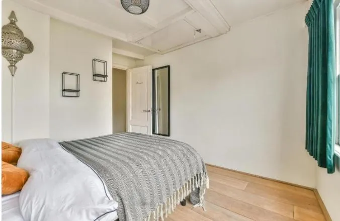 Bed in Spiegelgracht Apartments with Canal View