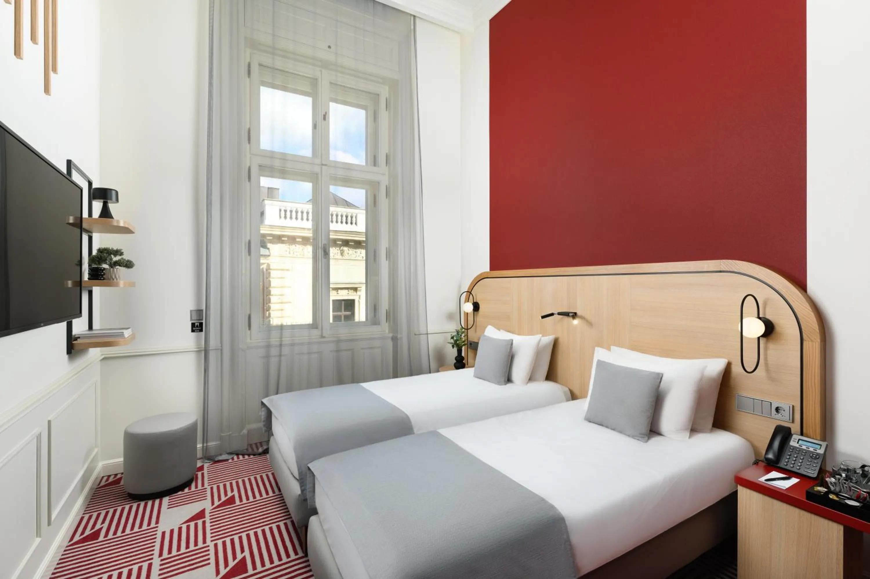 Photo of the whole room, Bed in Hotel Oktogon Haggenmacher by Continental Group
