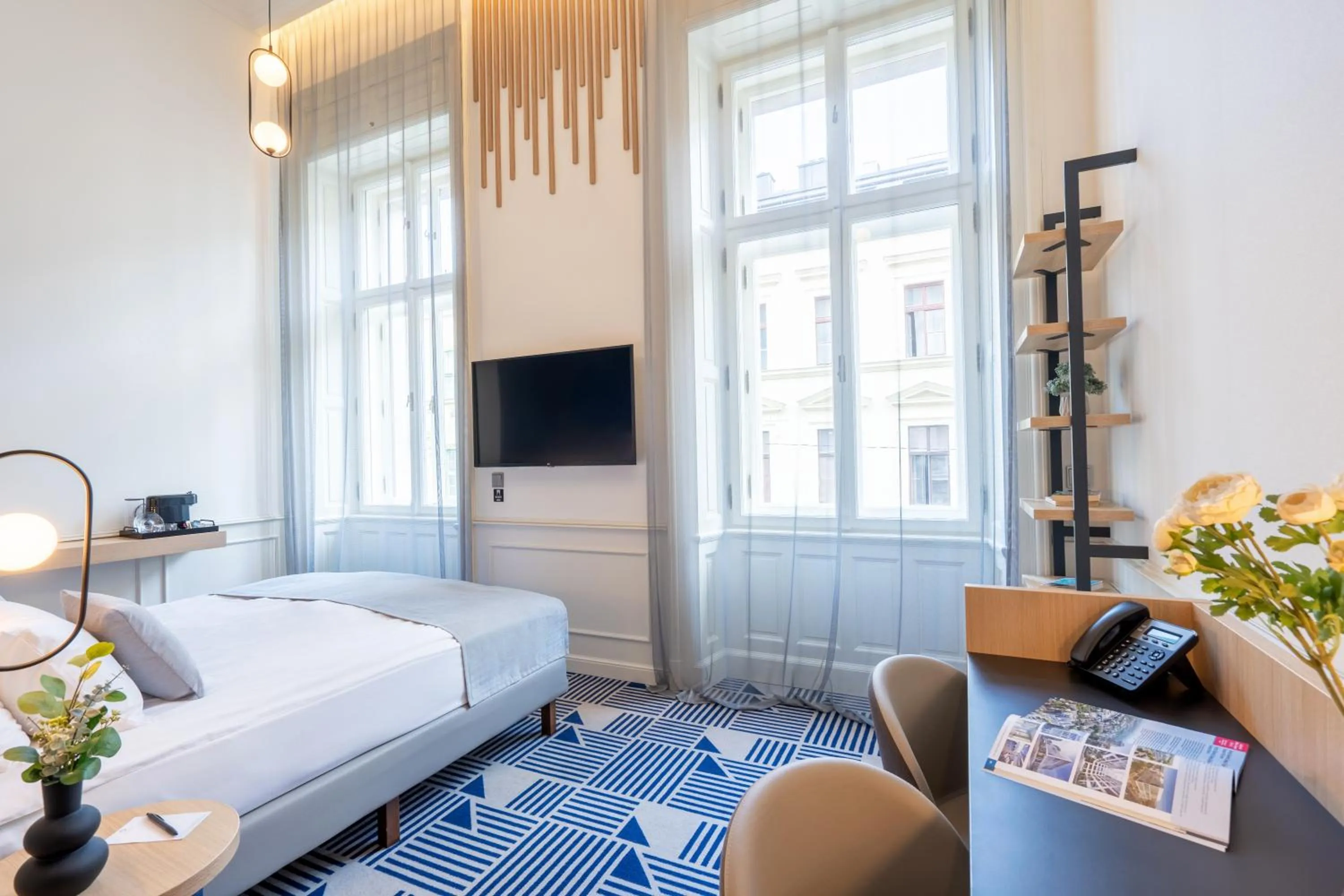 Bed in Hotel Oktogon Haggenmacher by Continental Group