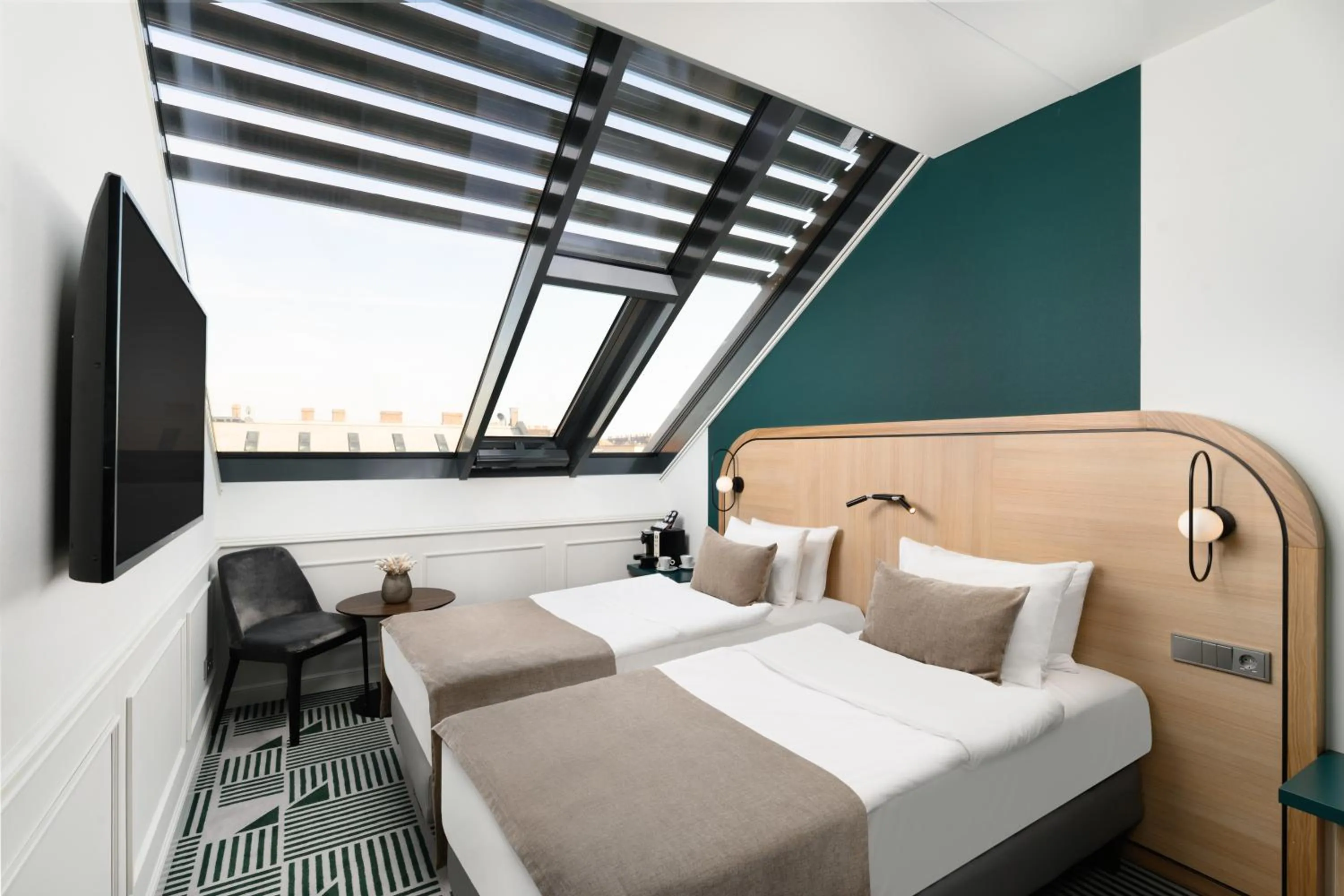 Bed in Hotel Oktogon Haggenmacher by Continental Group