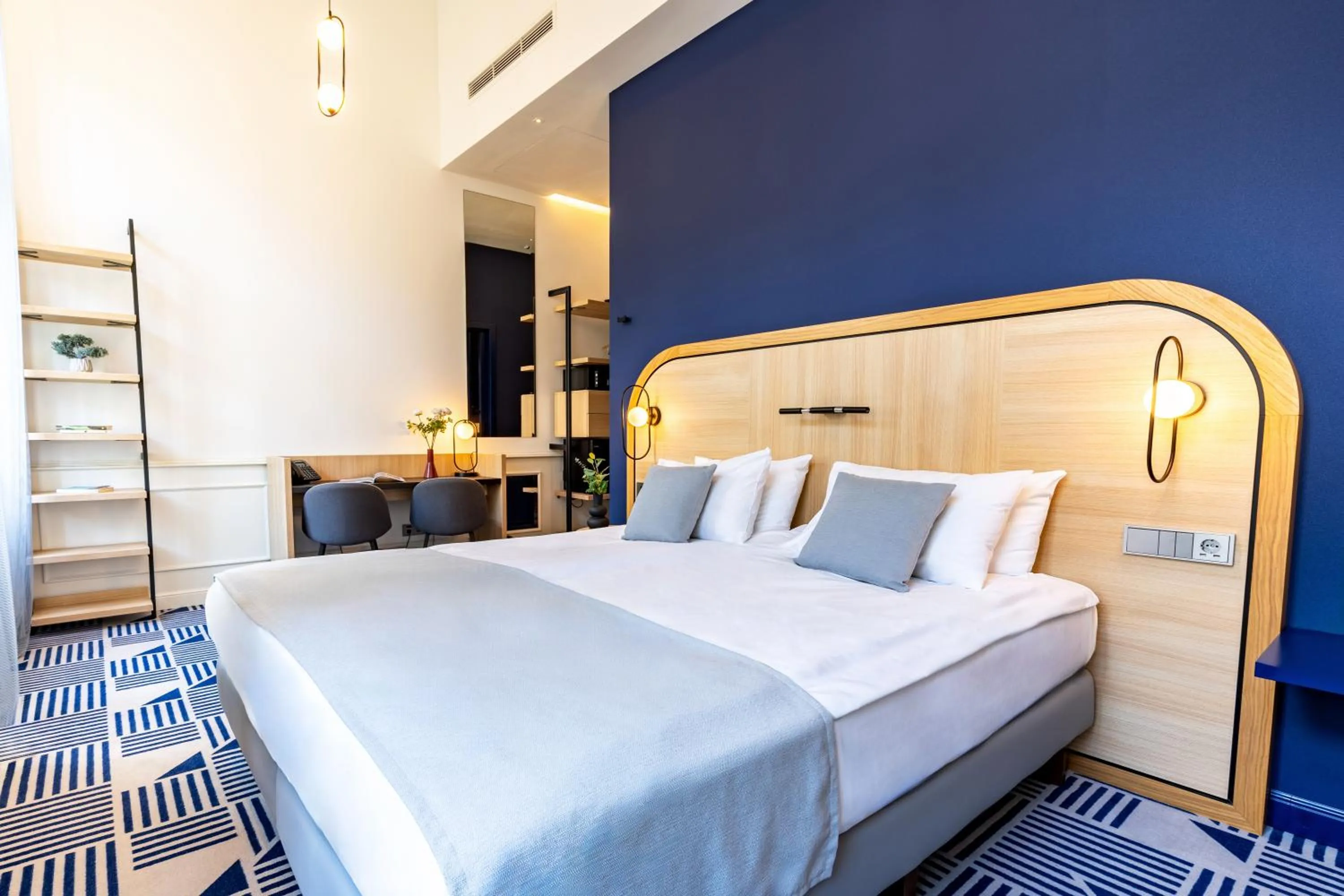 Bed in Hotel Oktogon Haggenmacher by Continental Group