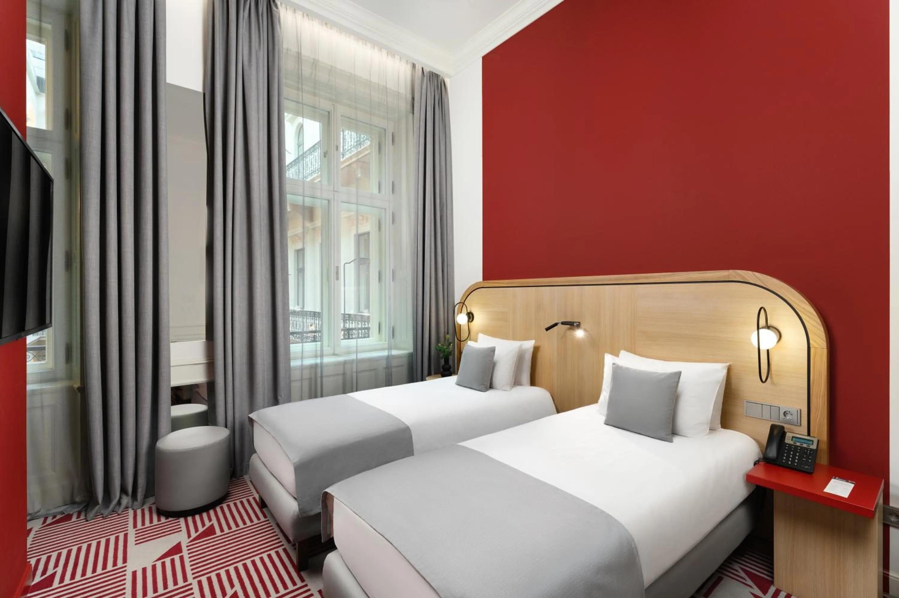 Bed in Hotel Oktogon Haggenmacher by Continental Group