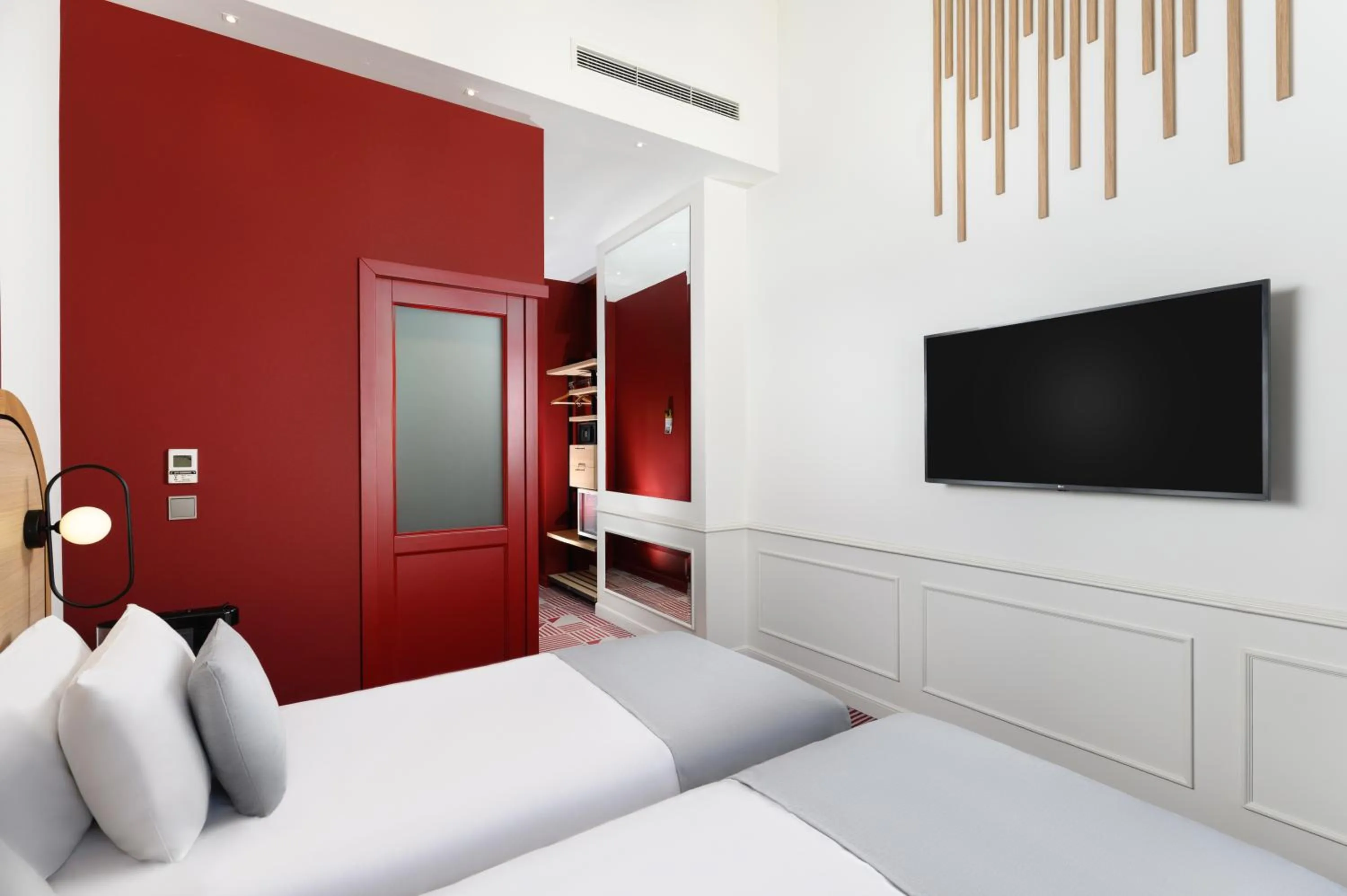 Bed in Hotel Oktogon Haggenmacher by Continental Group