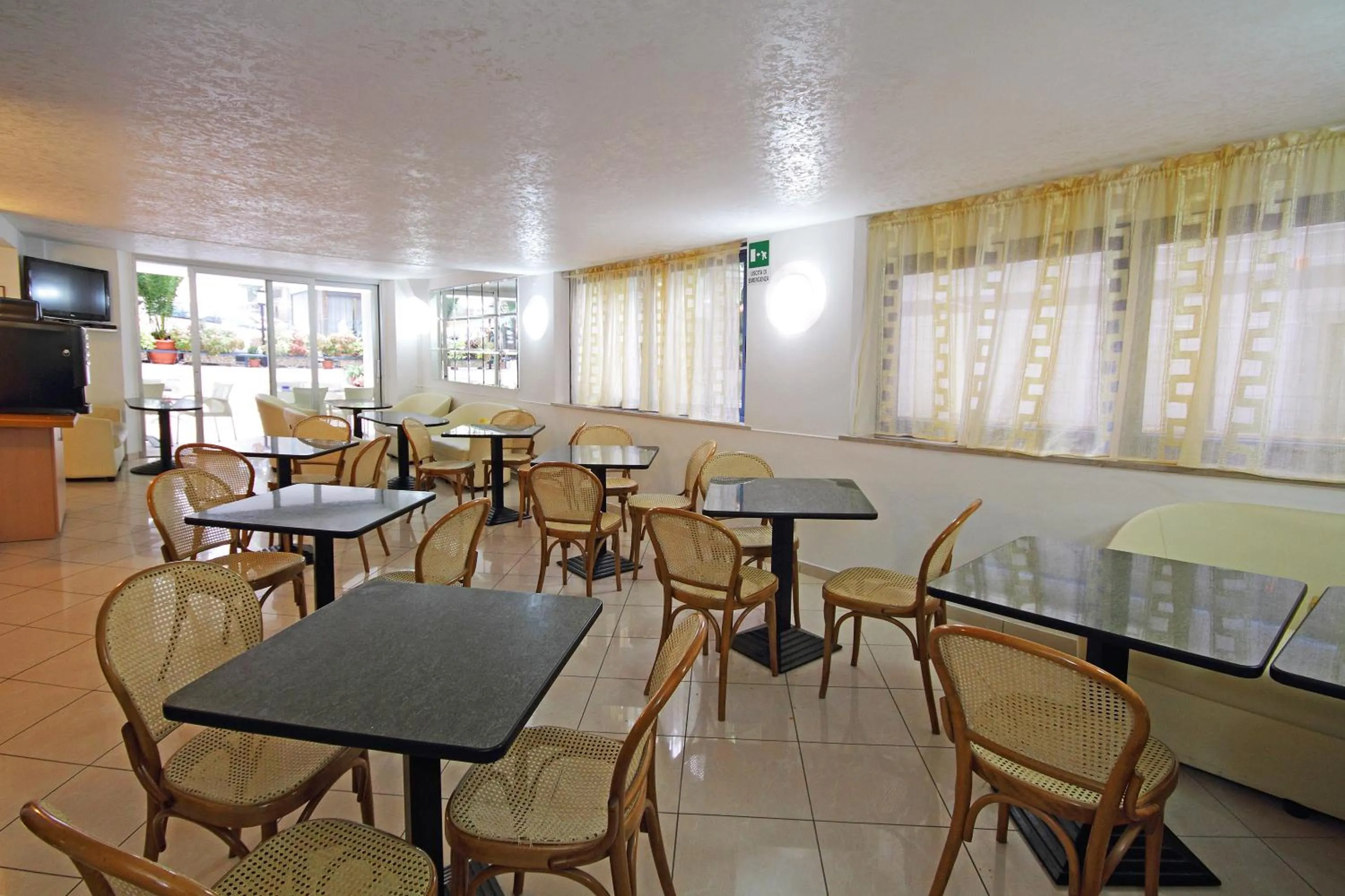 Communal lounge/ TV room in Hotel Azzurro