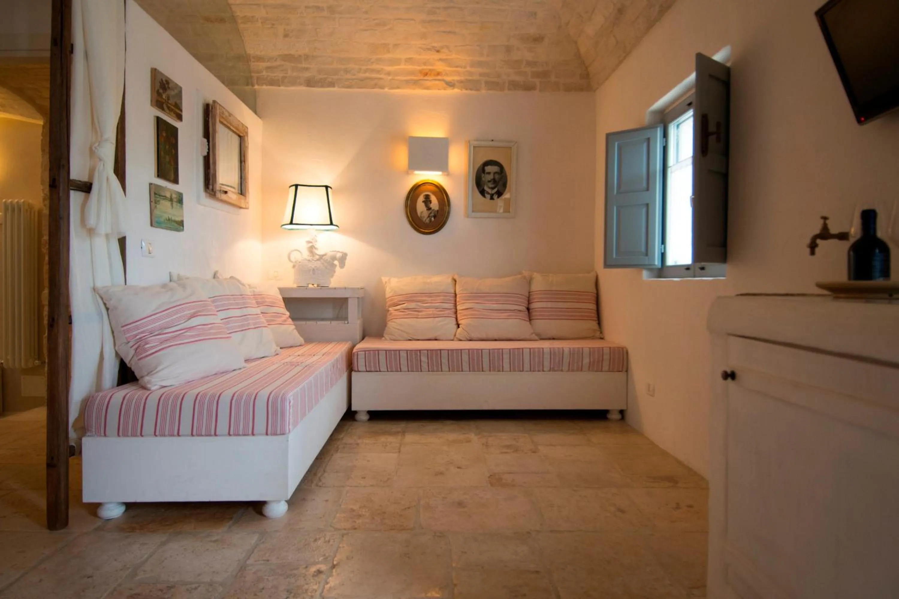 Living room, Bed in Masseria Salinola