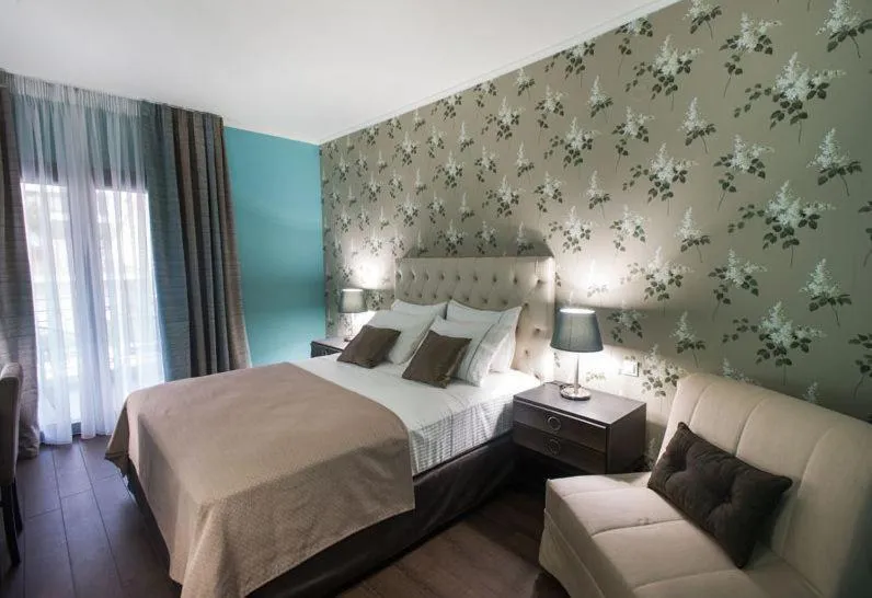 Bed in Theasis Hotel Paramythia