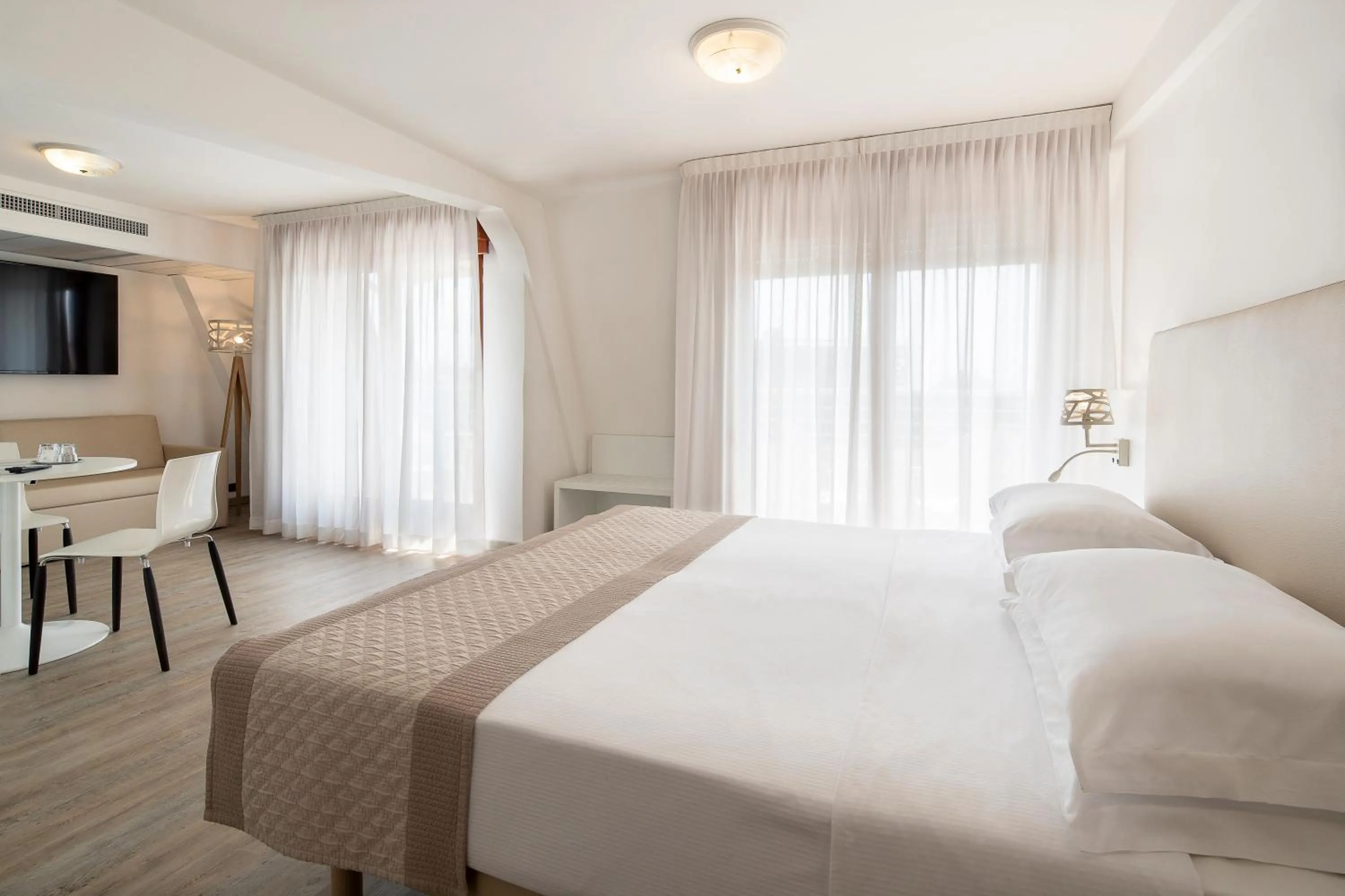 Bed in Fantinello Hotel