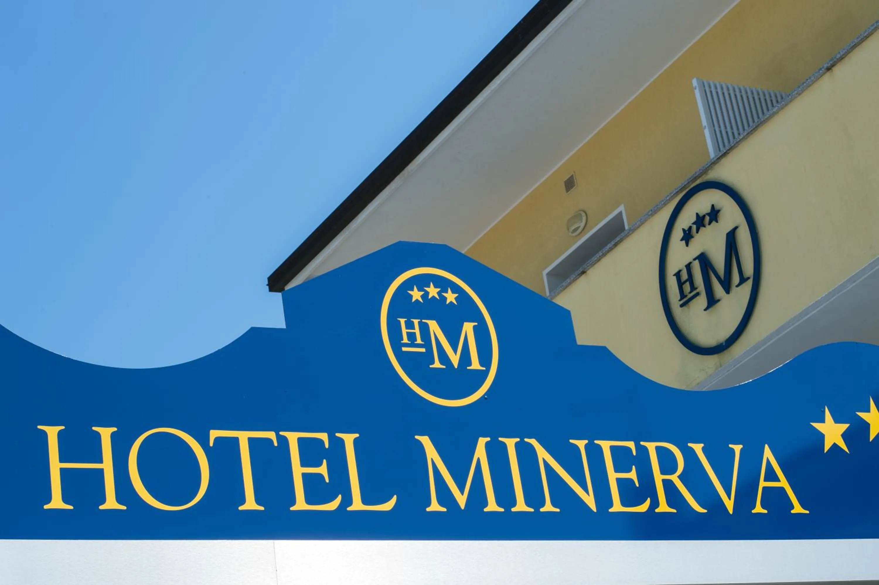 Property logo or sign in Hotel Minerva