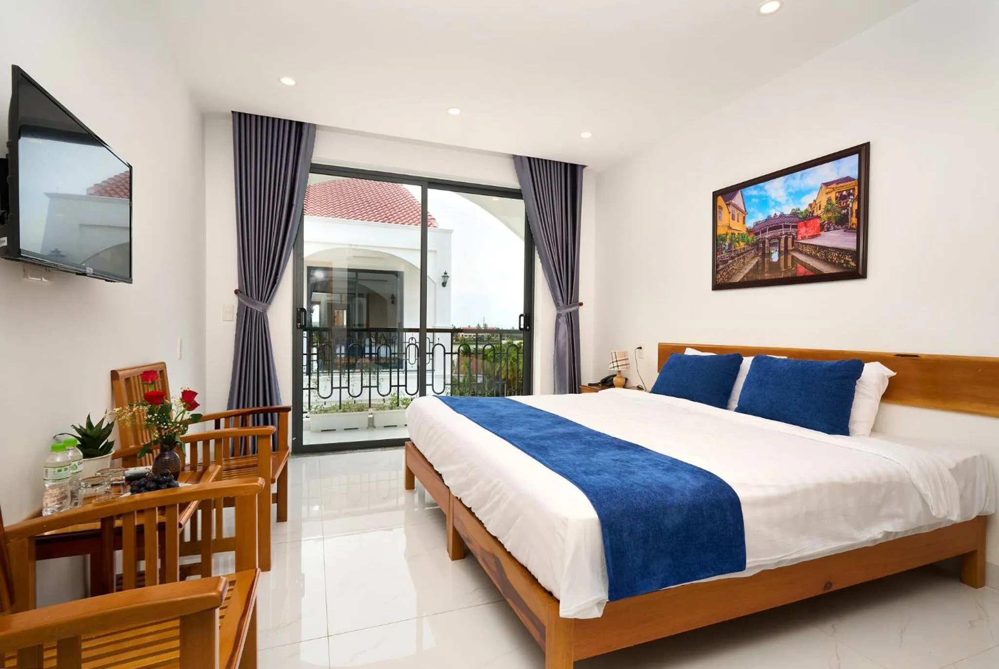 Communal lounge/ TV room, Bed in Hoi An Legend Charm Boutique Hoi An Hotel