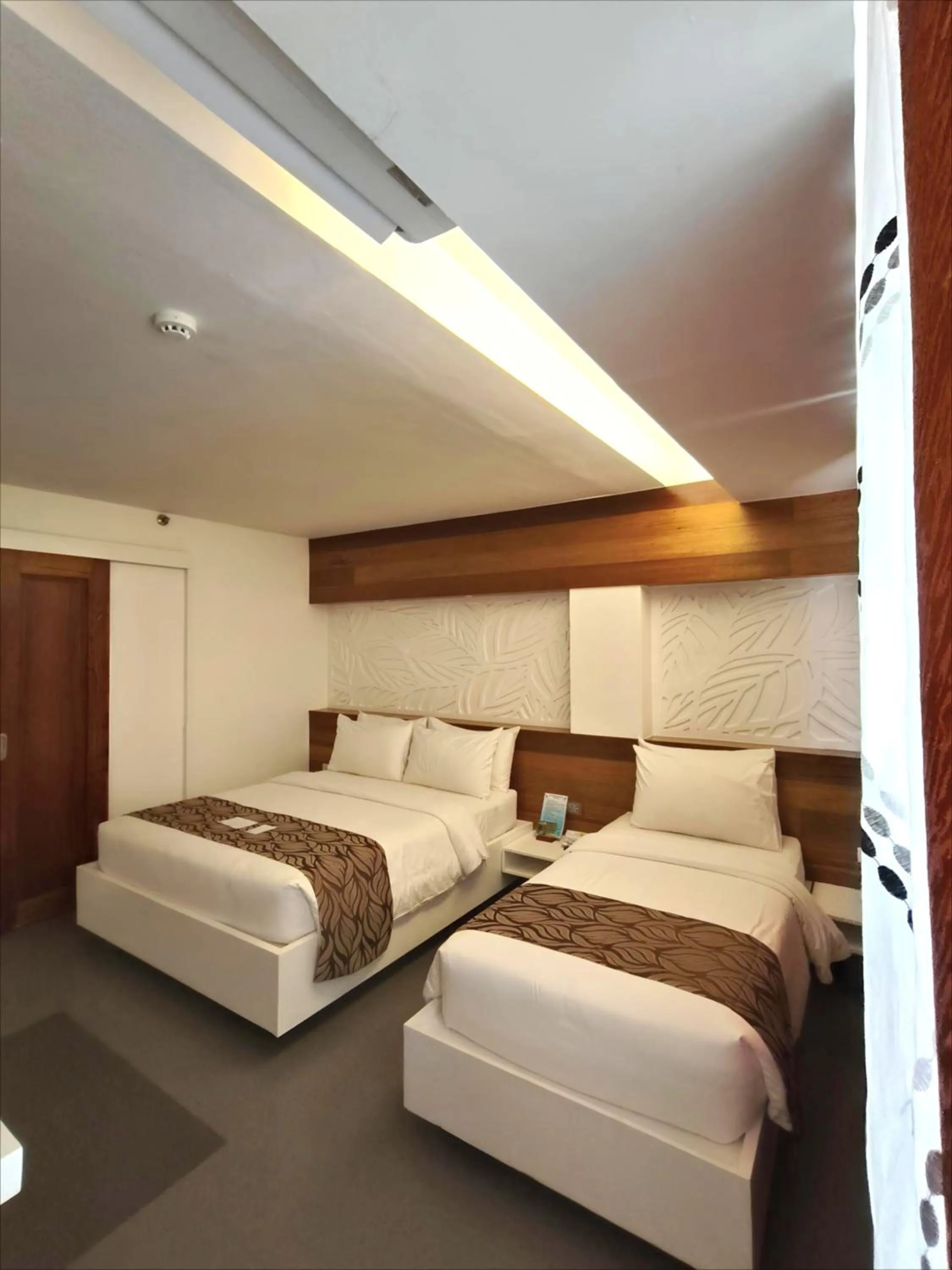 Bed in The Paragon Boracay Suites