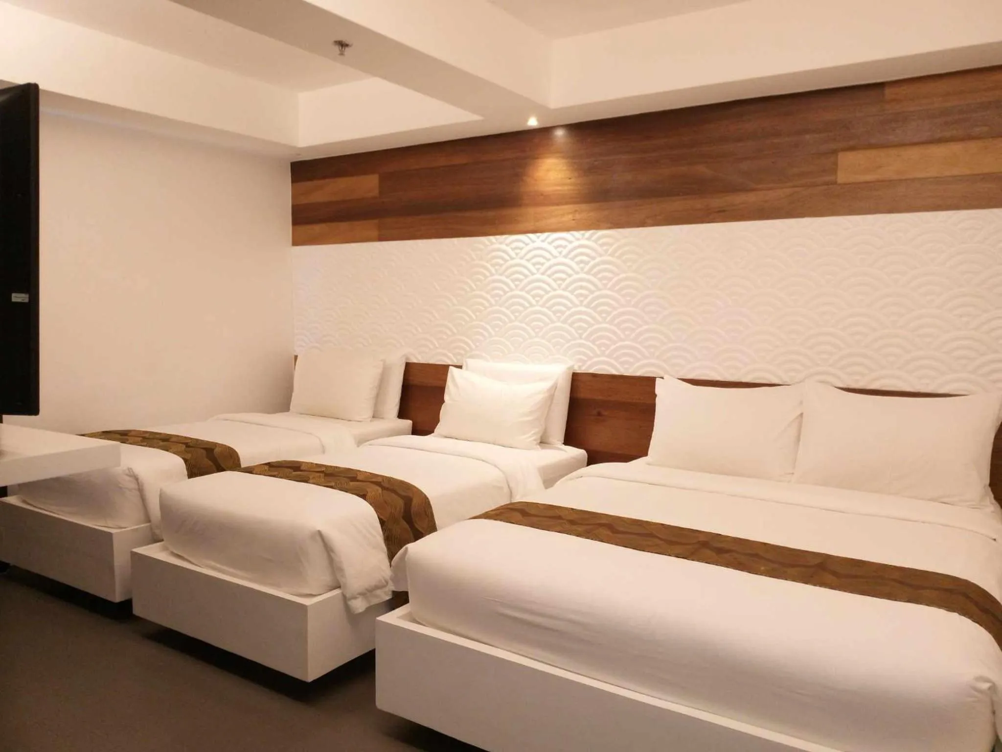 Bed in The Paragon Boracay Suites