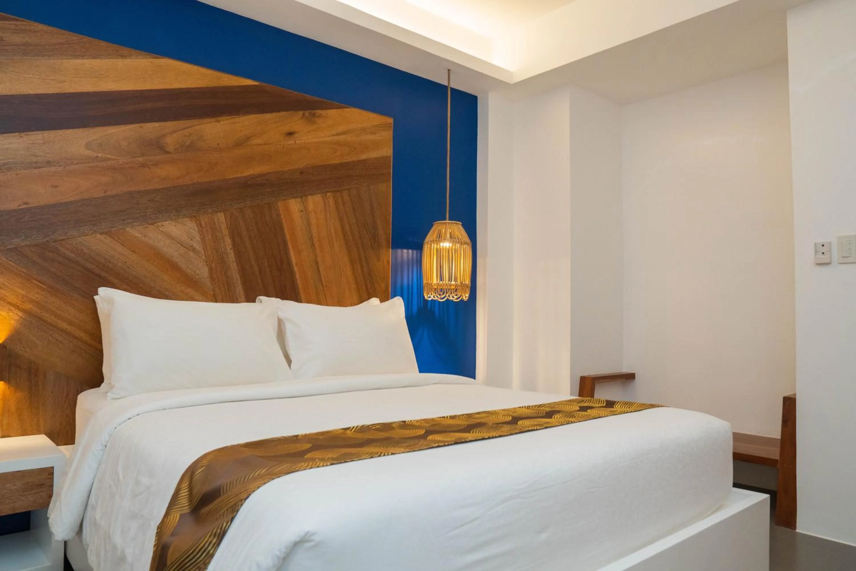 Bed in The Paragon Boracay Suites