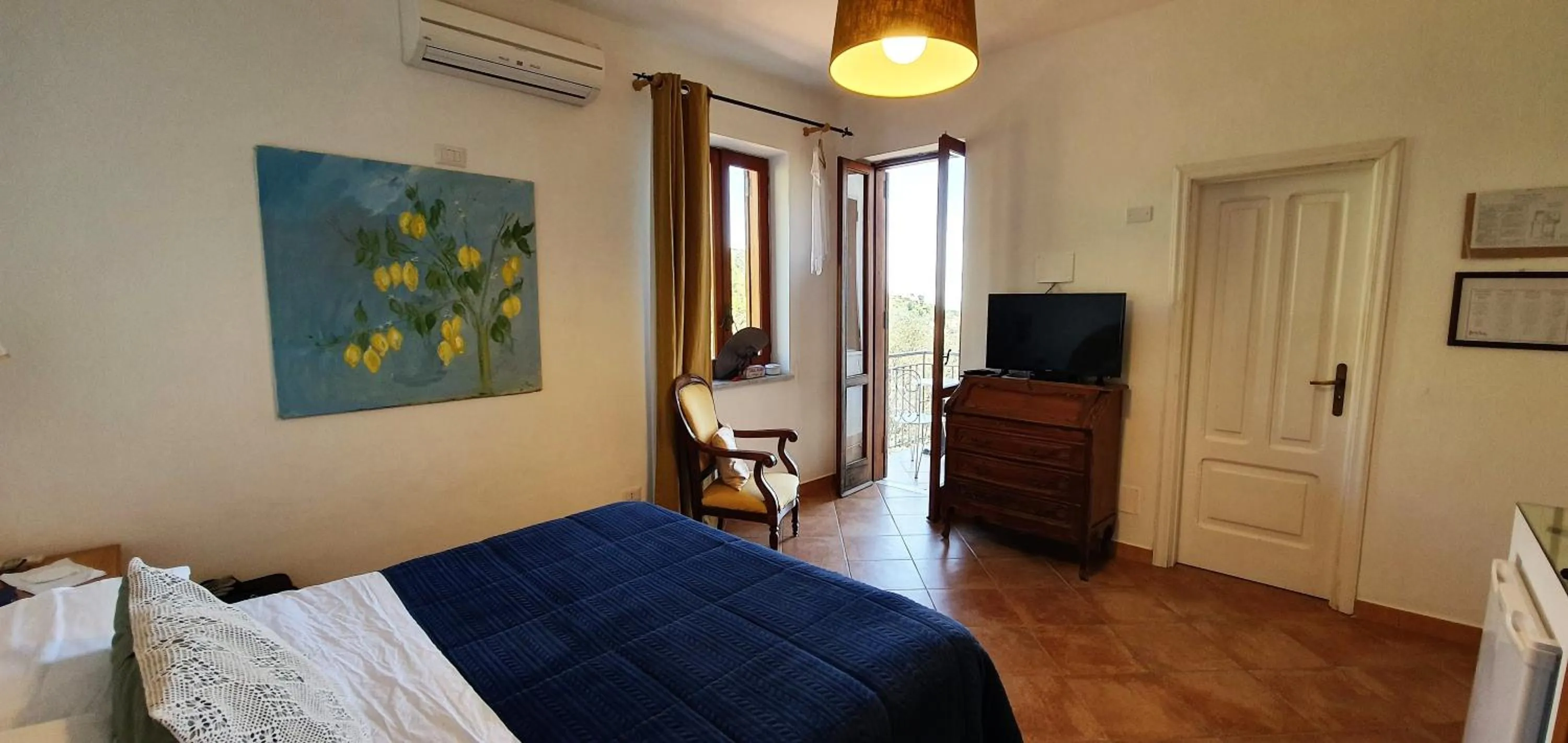 Communal lounge/ TV room, Bed in Agriturismo Fattoria Terranova