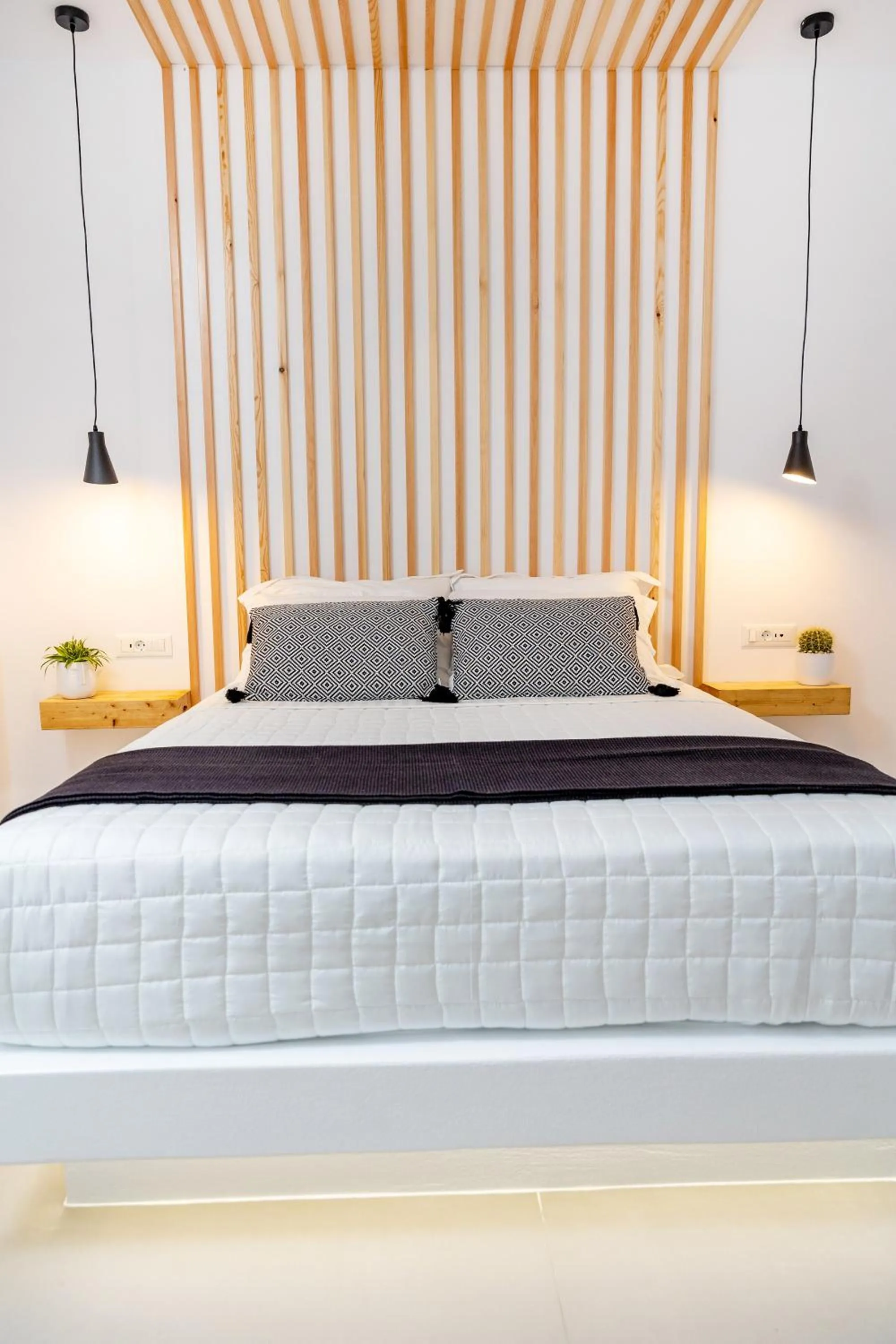 Bed in Alenor City Hotel