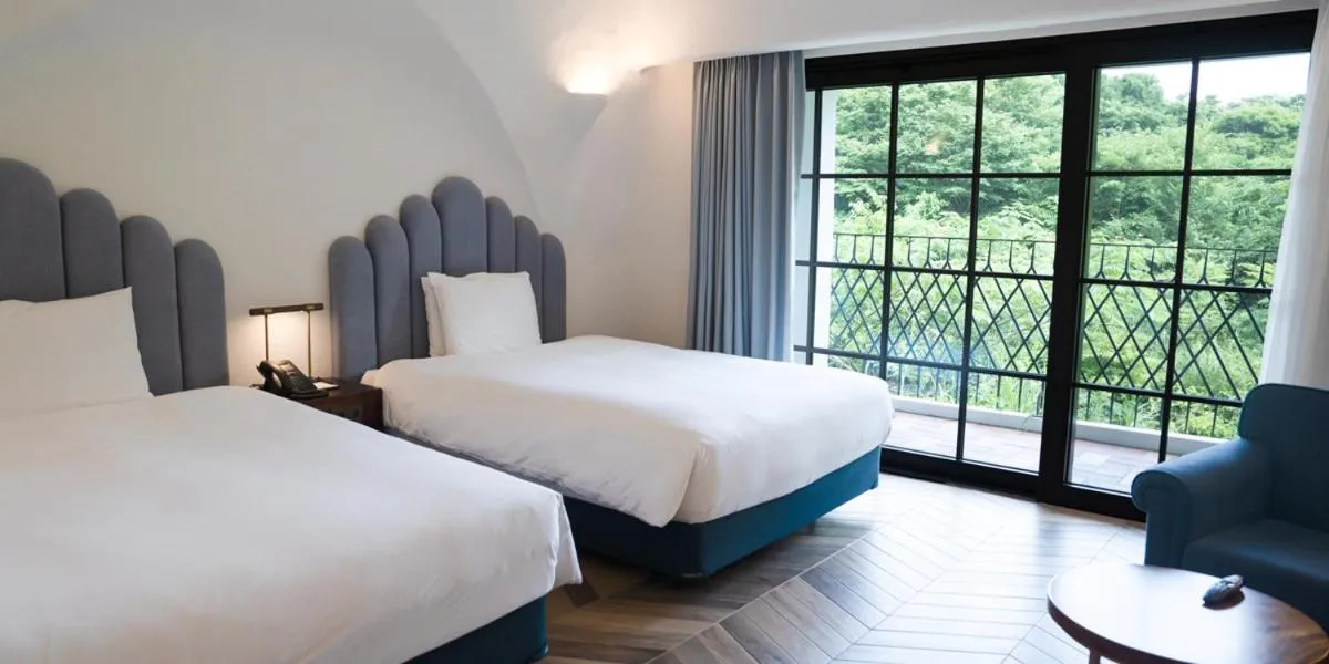 Bed in Ecoland Hotel