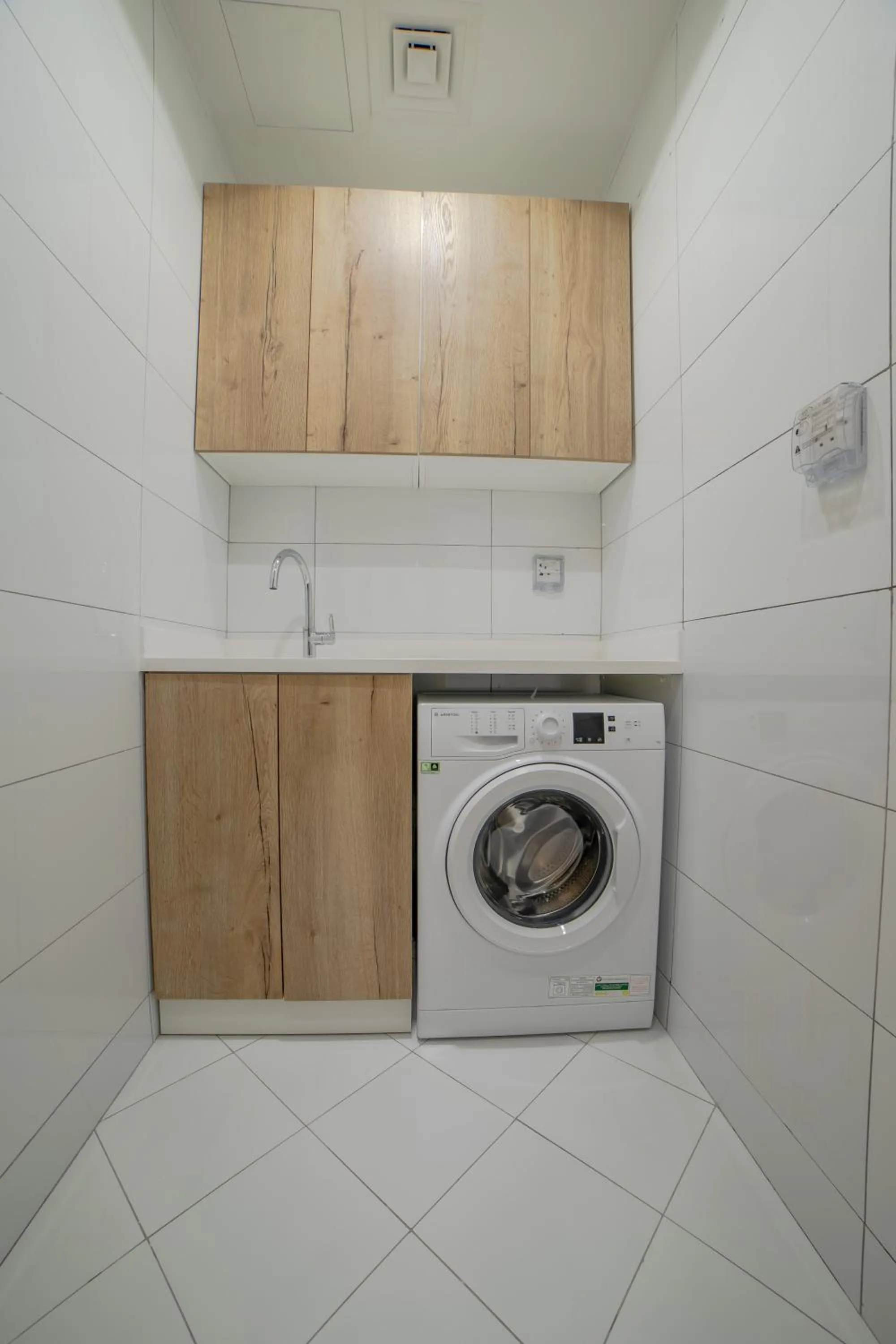 washing machine in Platinum Coast Hotel Apartments
