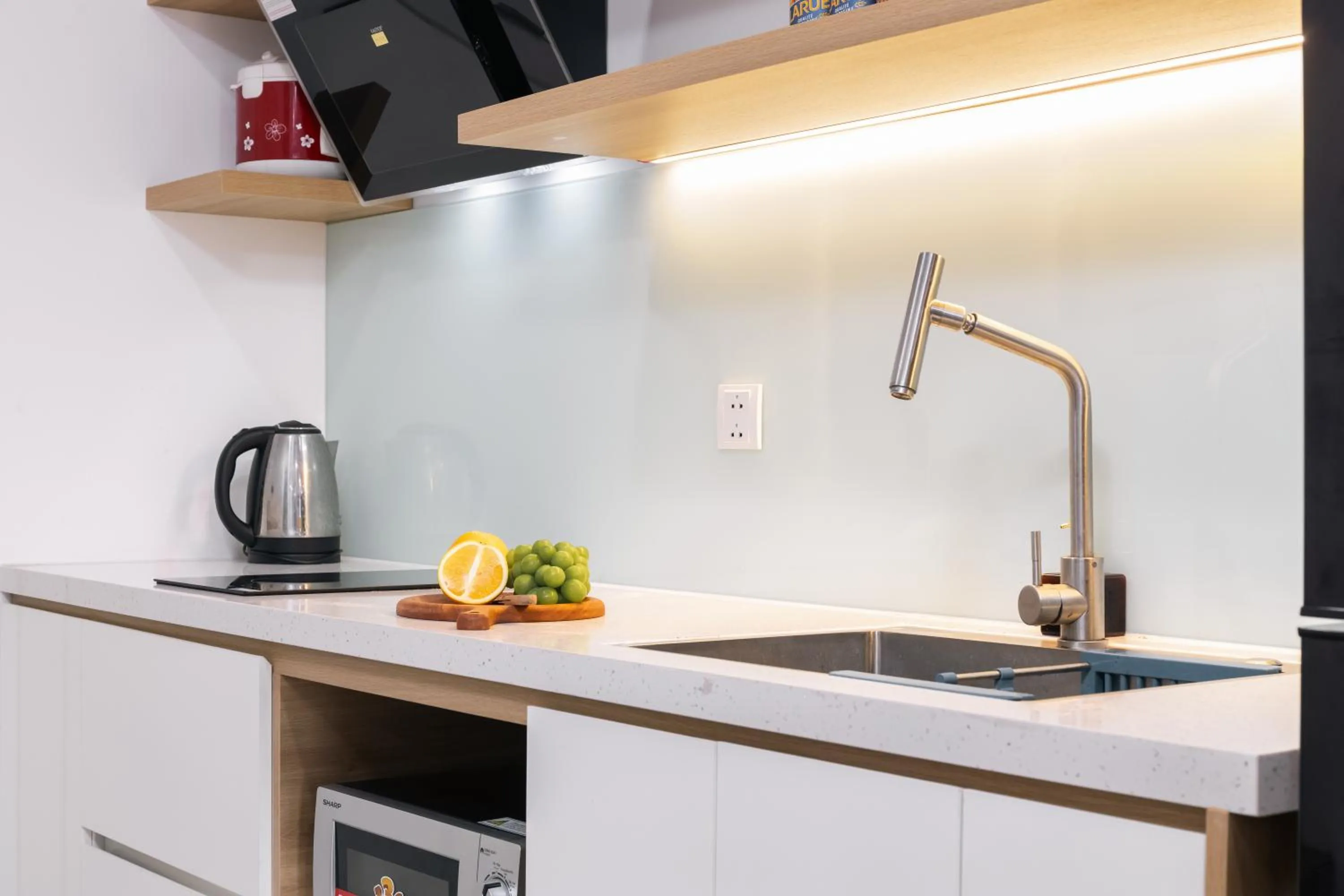 stove in LAGOM APARTMENT AND HOTEL