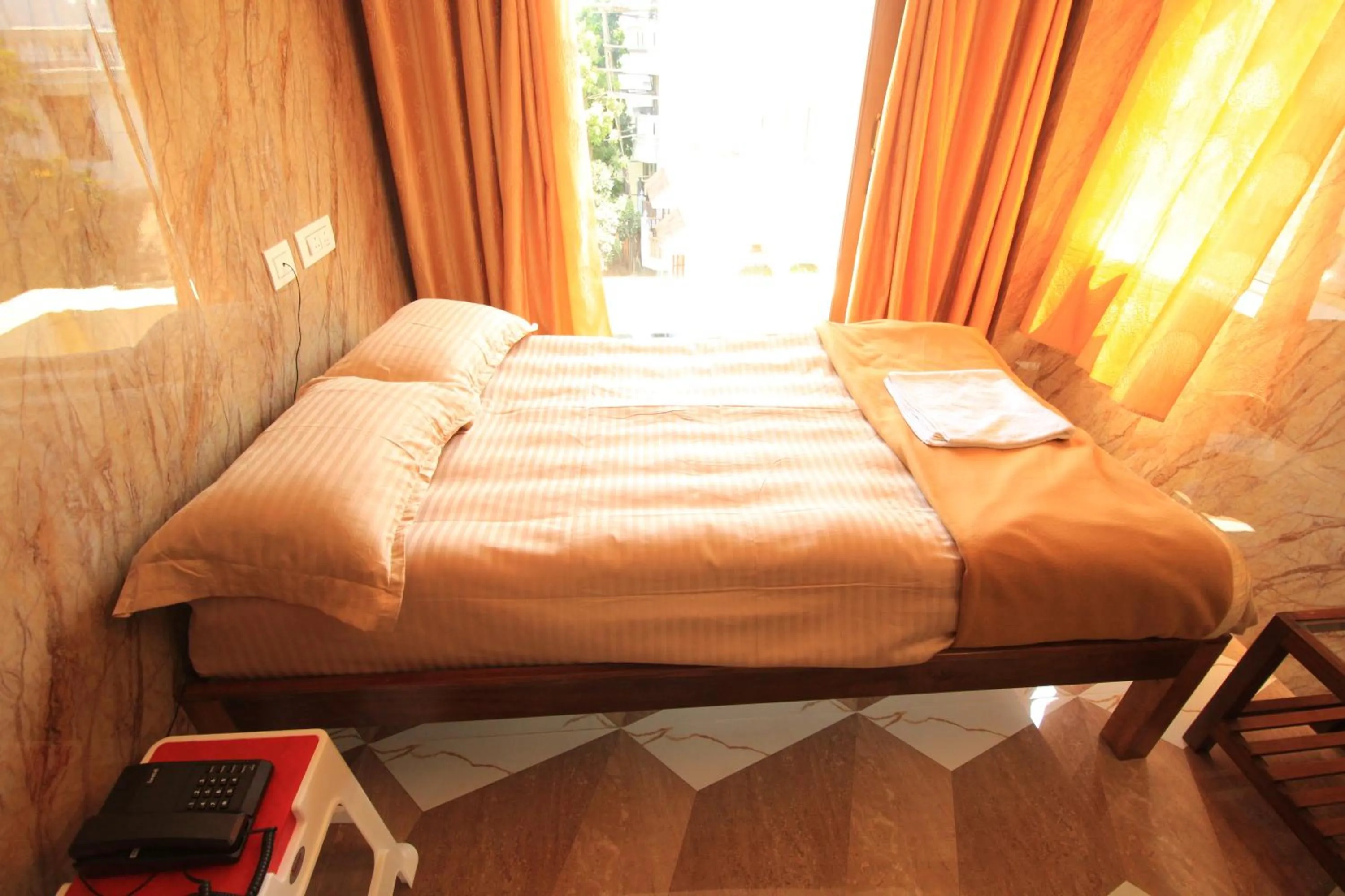 Bed in French Breeze Residency