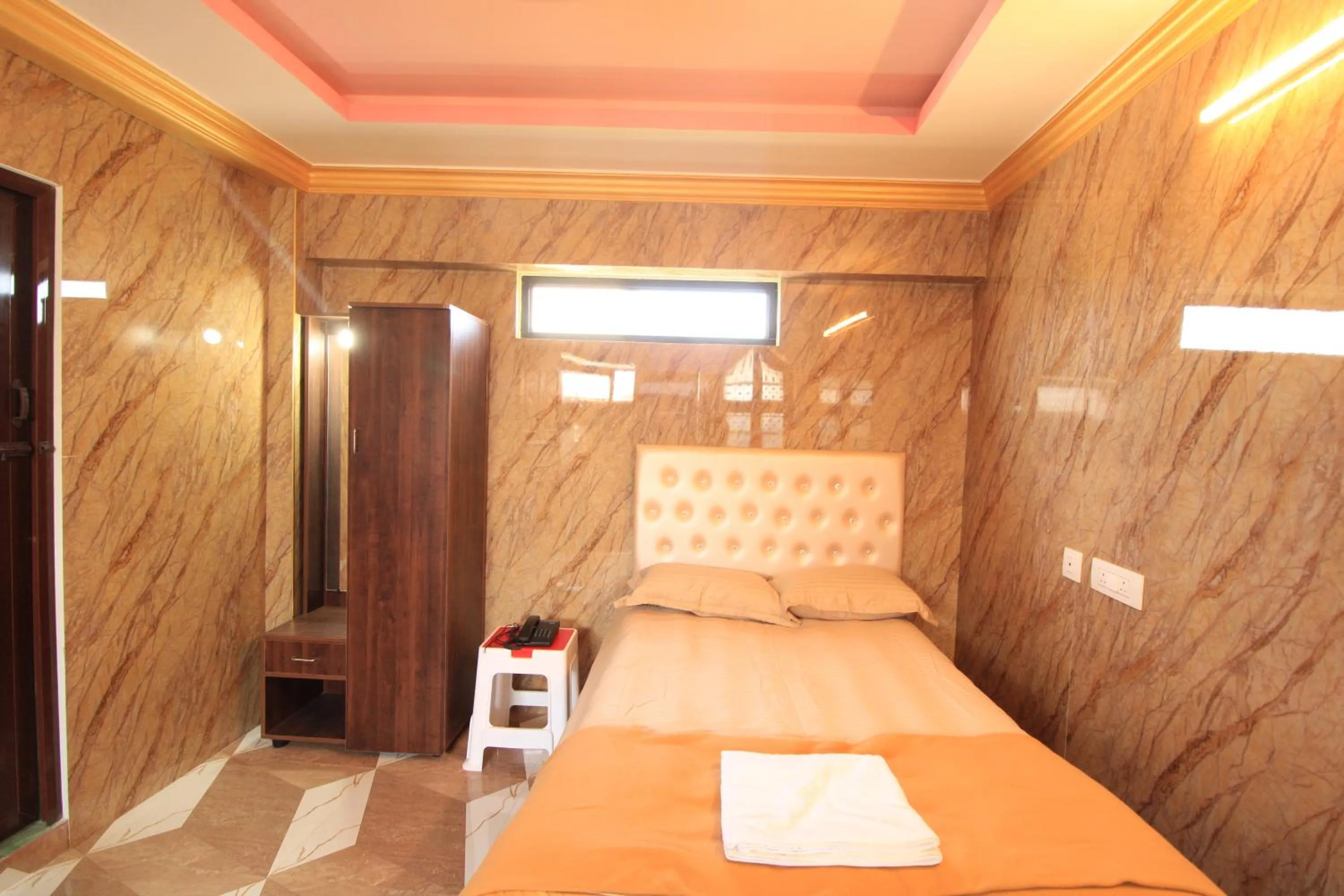 Bed in French Breeze Residency