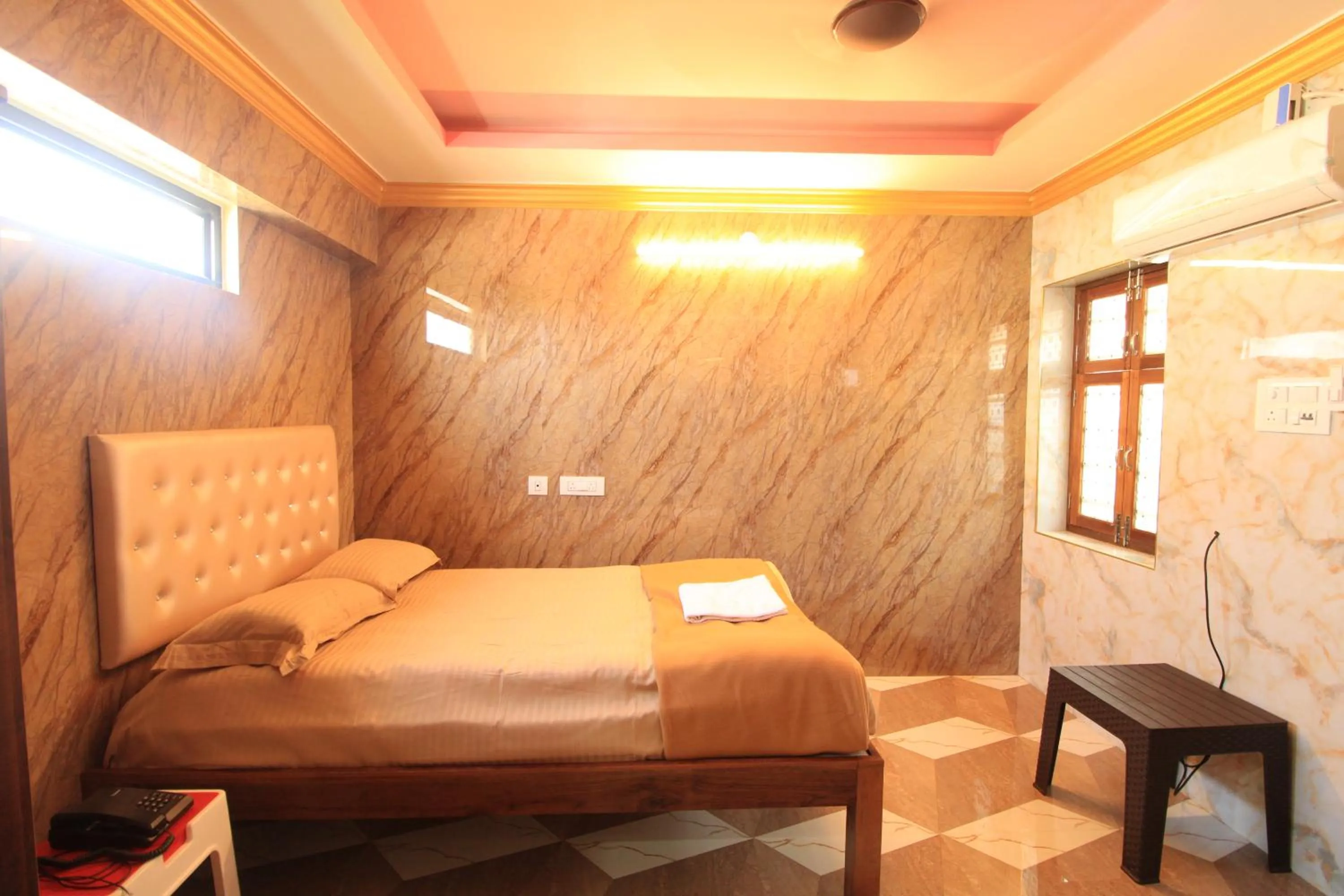 Bed in French Breeze Residency