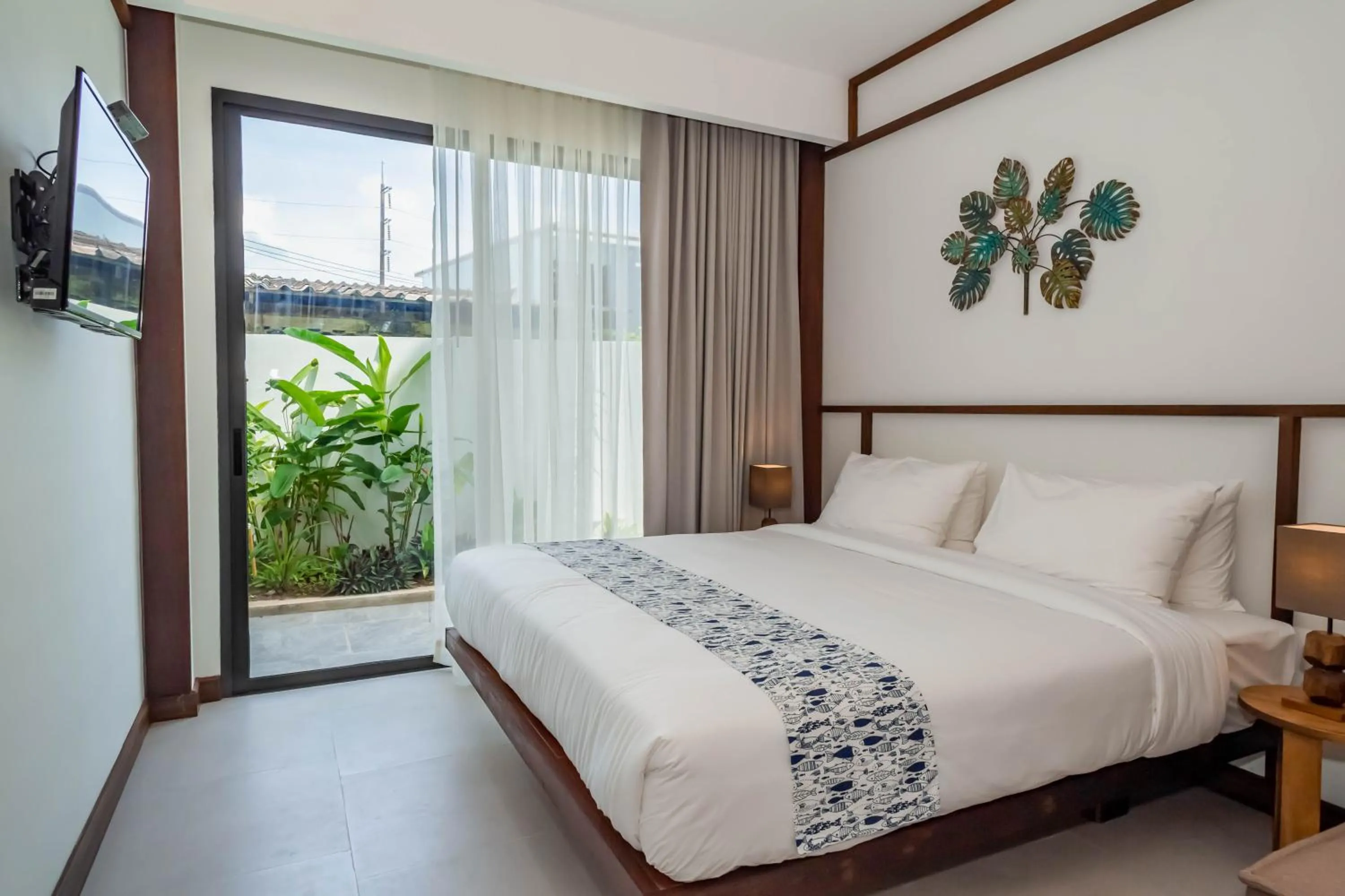 Bed in Baan Kamana Guest House