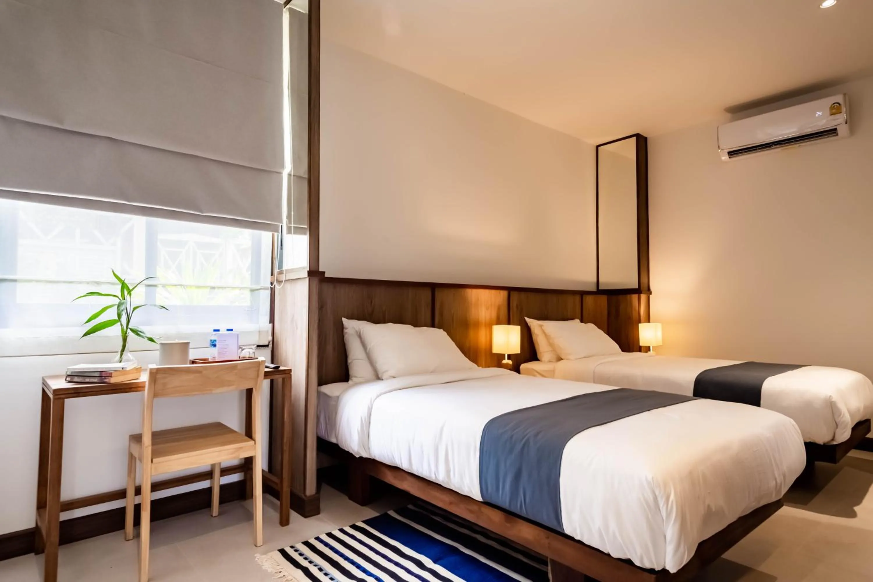 Bed in Baan Kamana Guest House