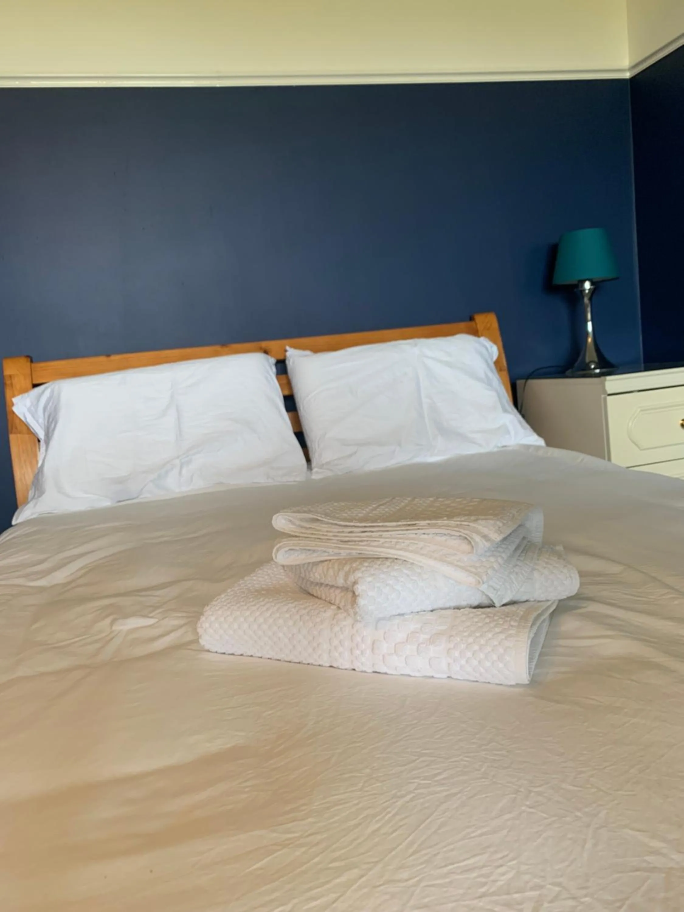 Bed in Orchard House Lodges by Ecohuman