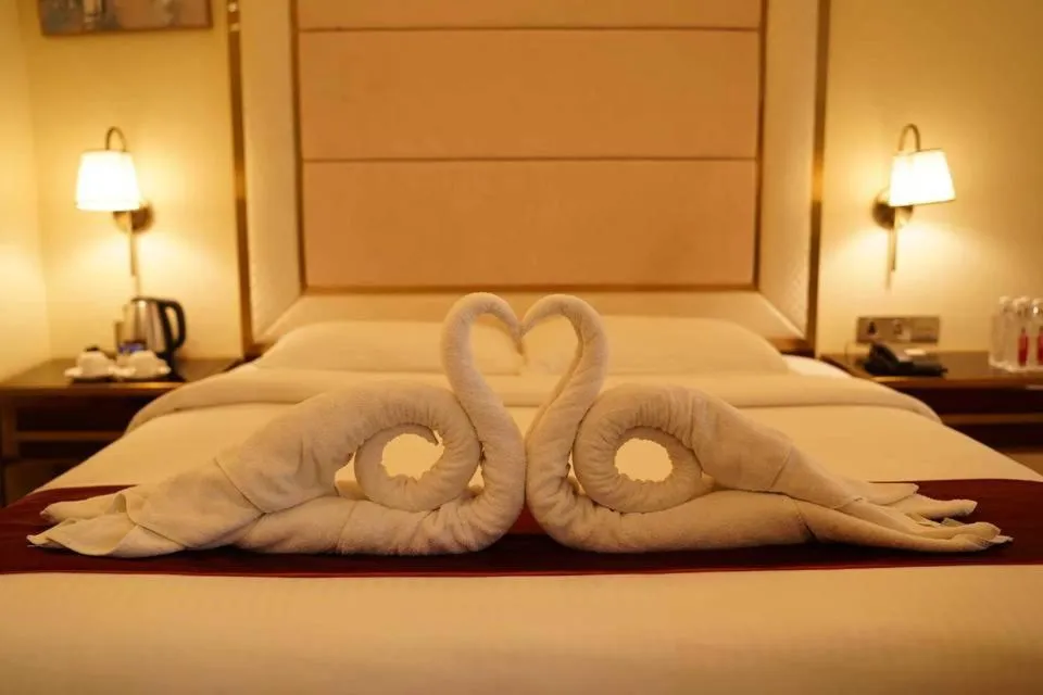 Bed in KAY-EM Spectra Hotel