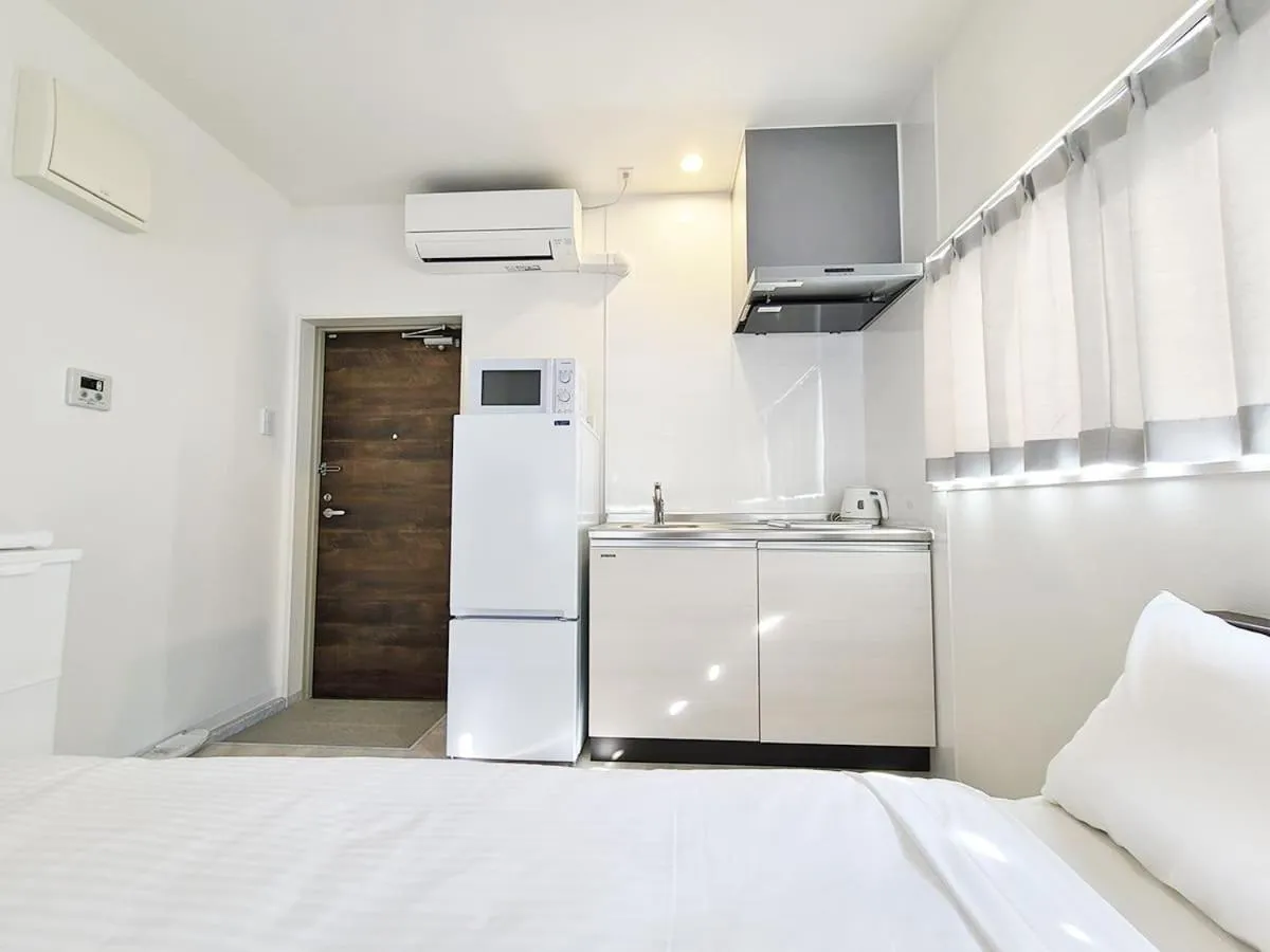 Kitchen or kitchenette, Bed in HOTEL Kuu