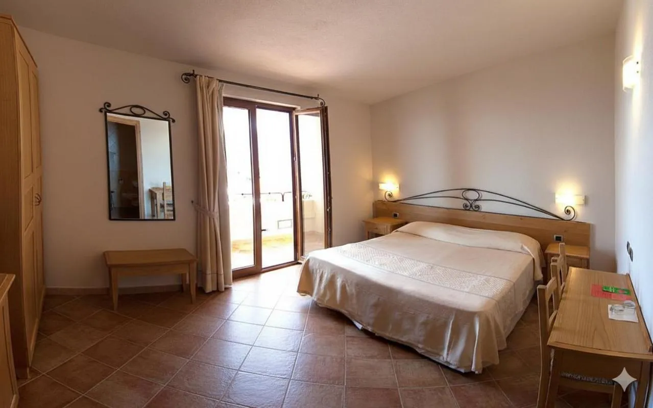 Bed in Hotel Villa Gustui Maris