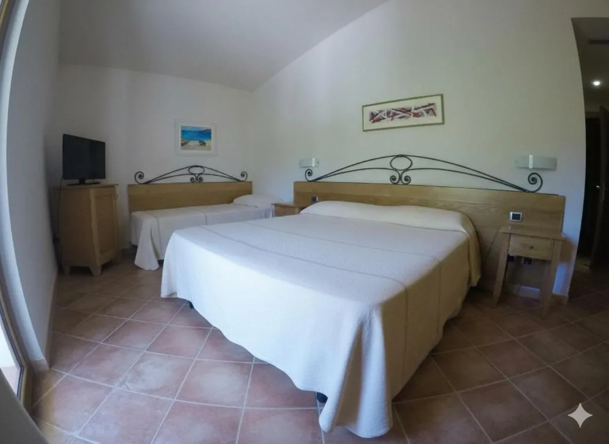 Bed in Hotel Villa Gustui Maris