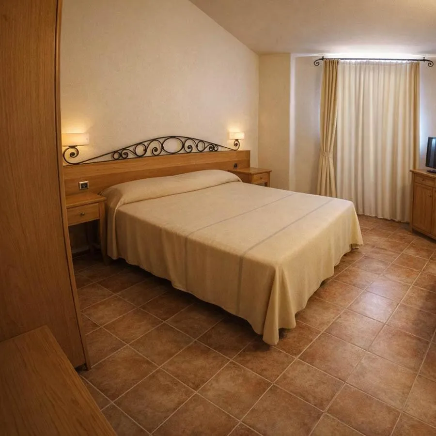 Bed in Hotel Villa Gustui Maris