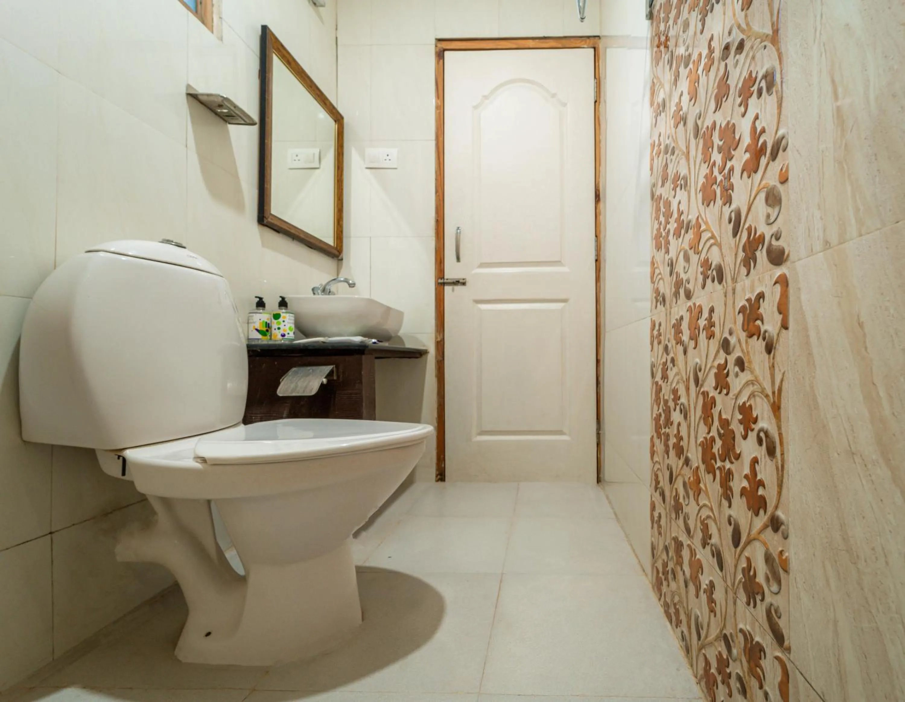 Toilet in Treebo Gulmohar Beach Resort with Pool
