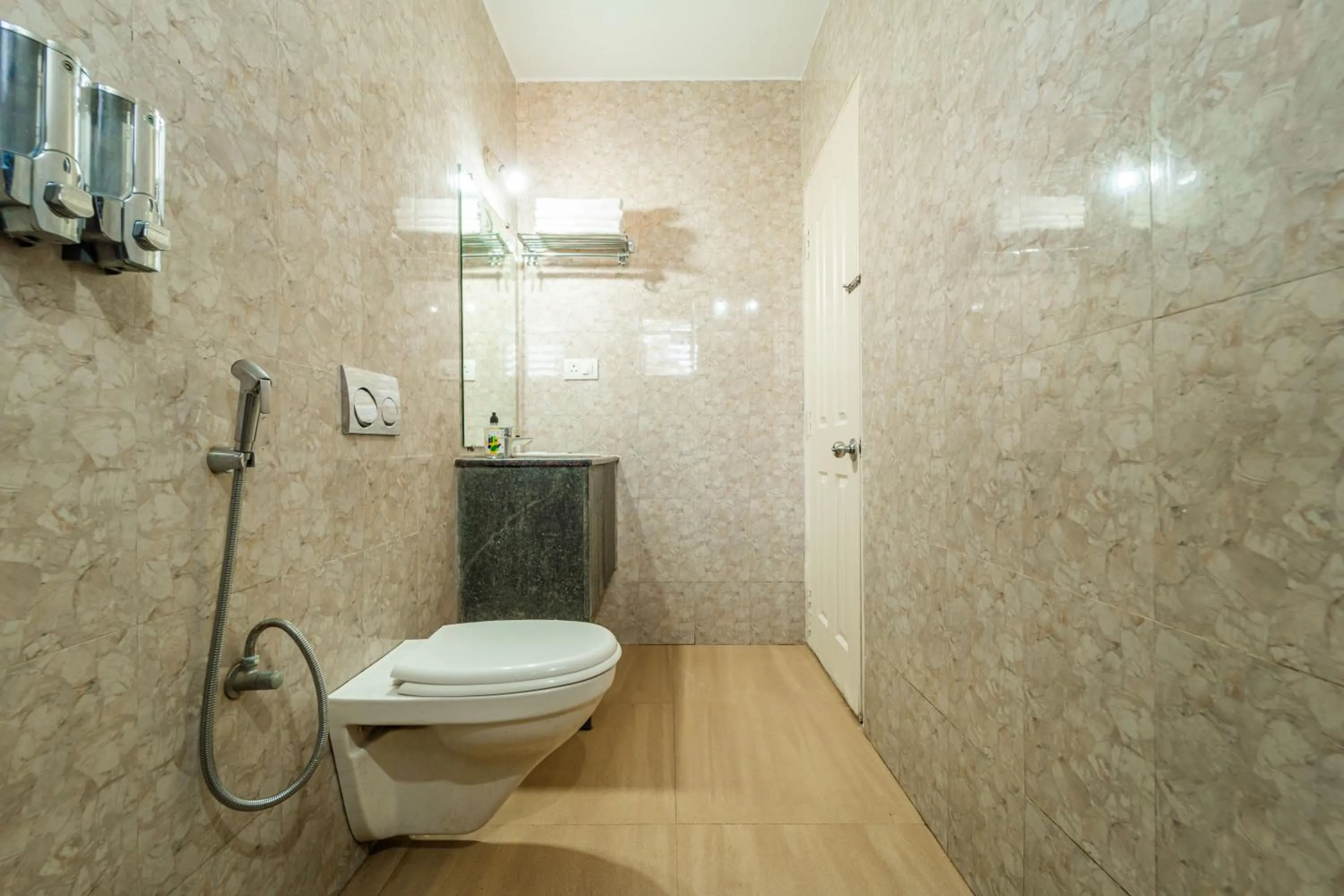 Toilet in Treebo Gulmohar Beach Resort with Pool