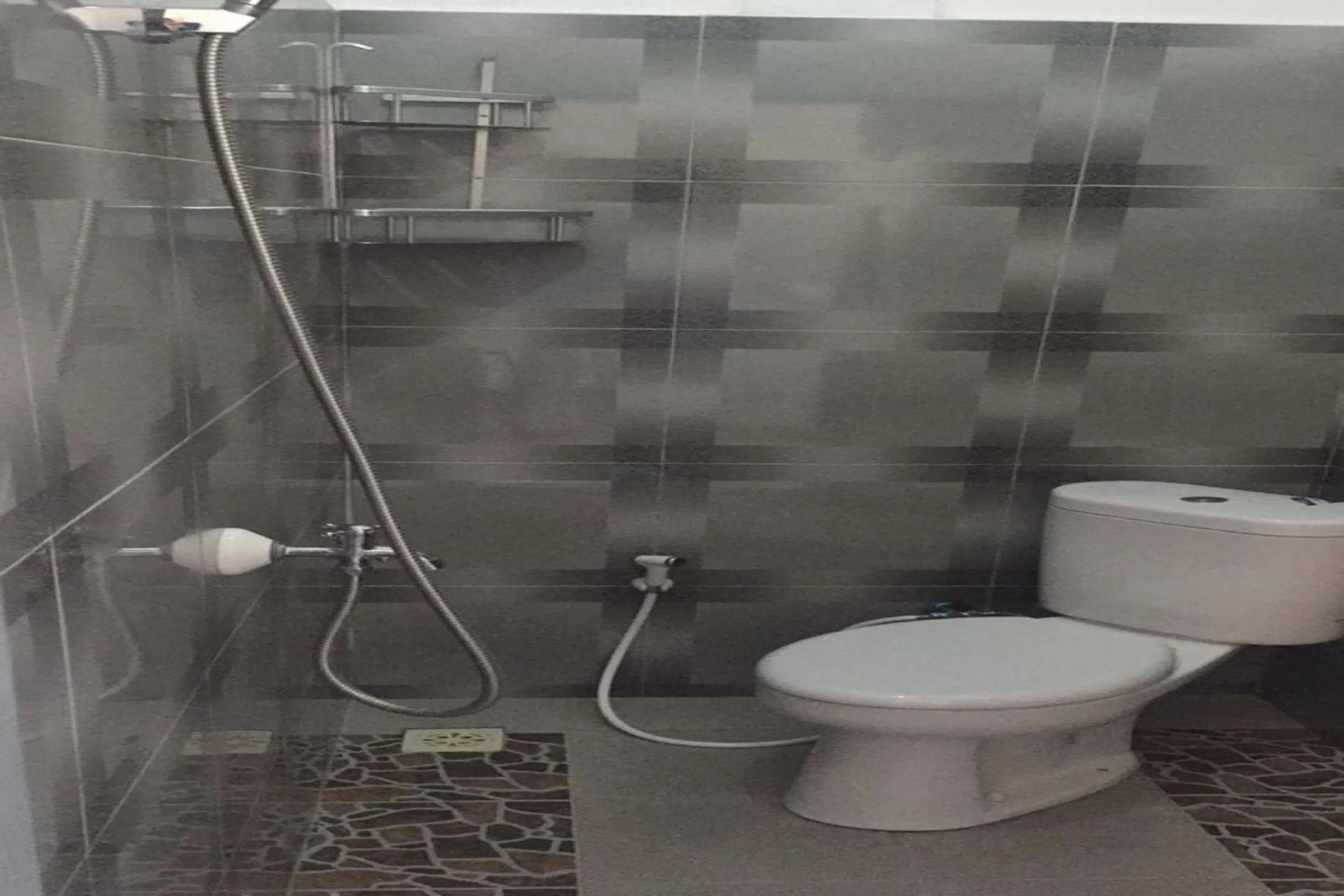 Bathroom in Hotel O Kelimutu Eco VillageNearMurundao Waterfall