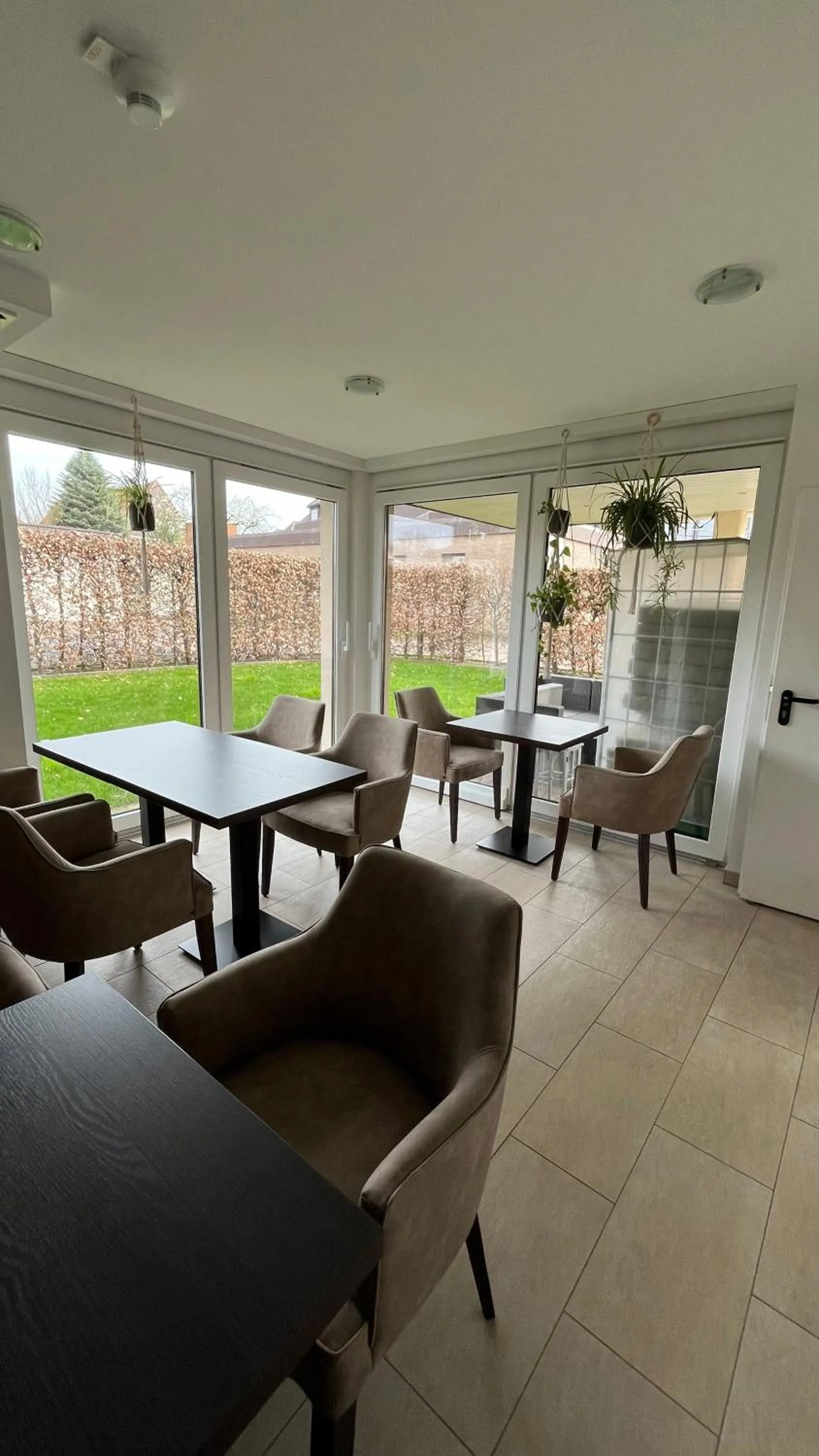 Communal lounge/ TV room in Gästehaus an der Oase