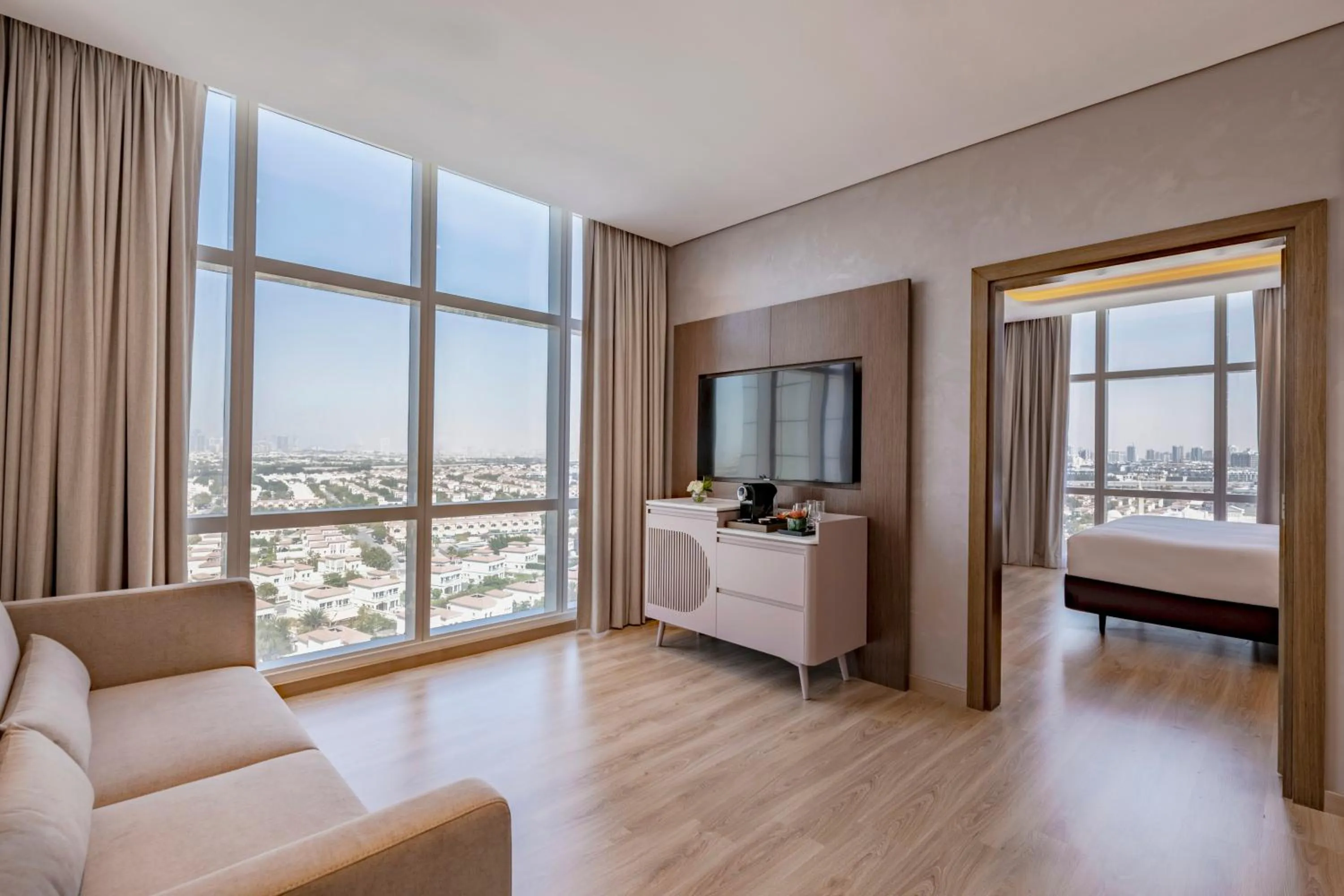 Living room, Bed in Movenpick Jumeirah Village Triangle