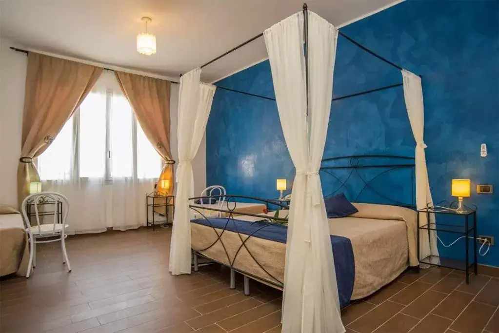 Quadruple Room in Hotel Noto Marina e Spa Quadruple Room in Hotel Noto Marina e Spa