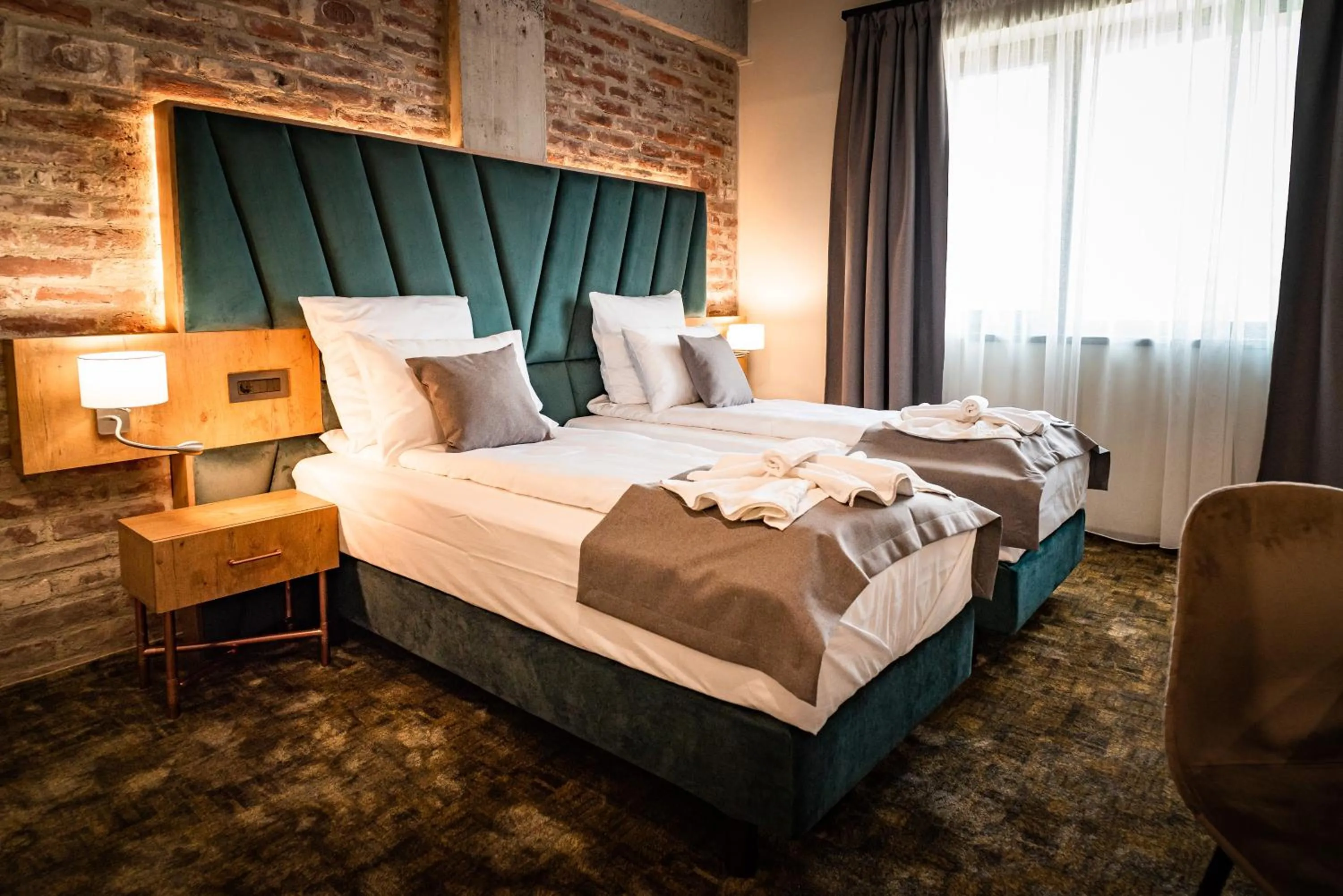 Bed in Mustang Boutique Rooms