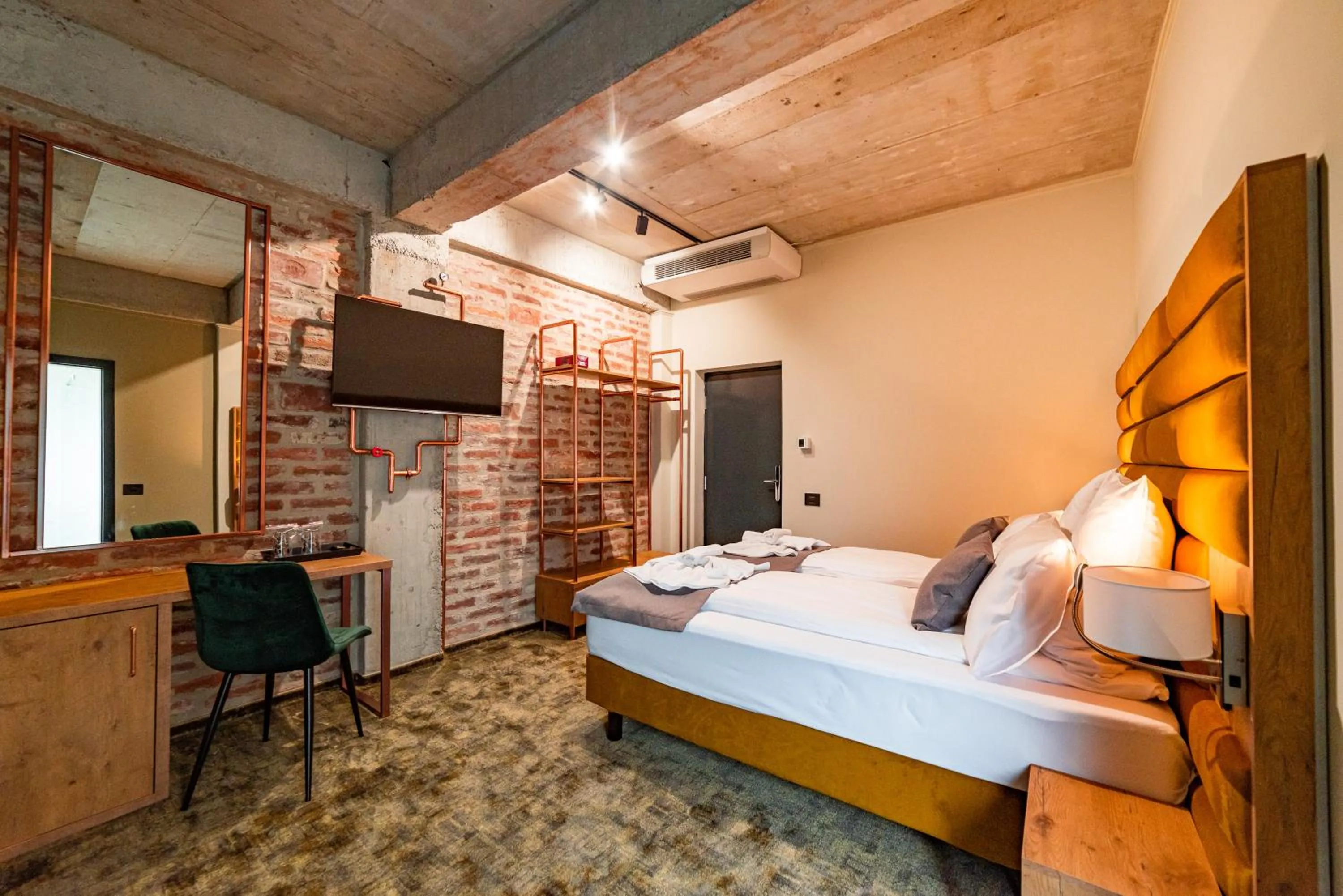 Bed in Mustang Boutique Rooms